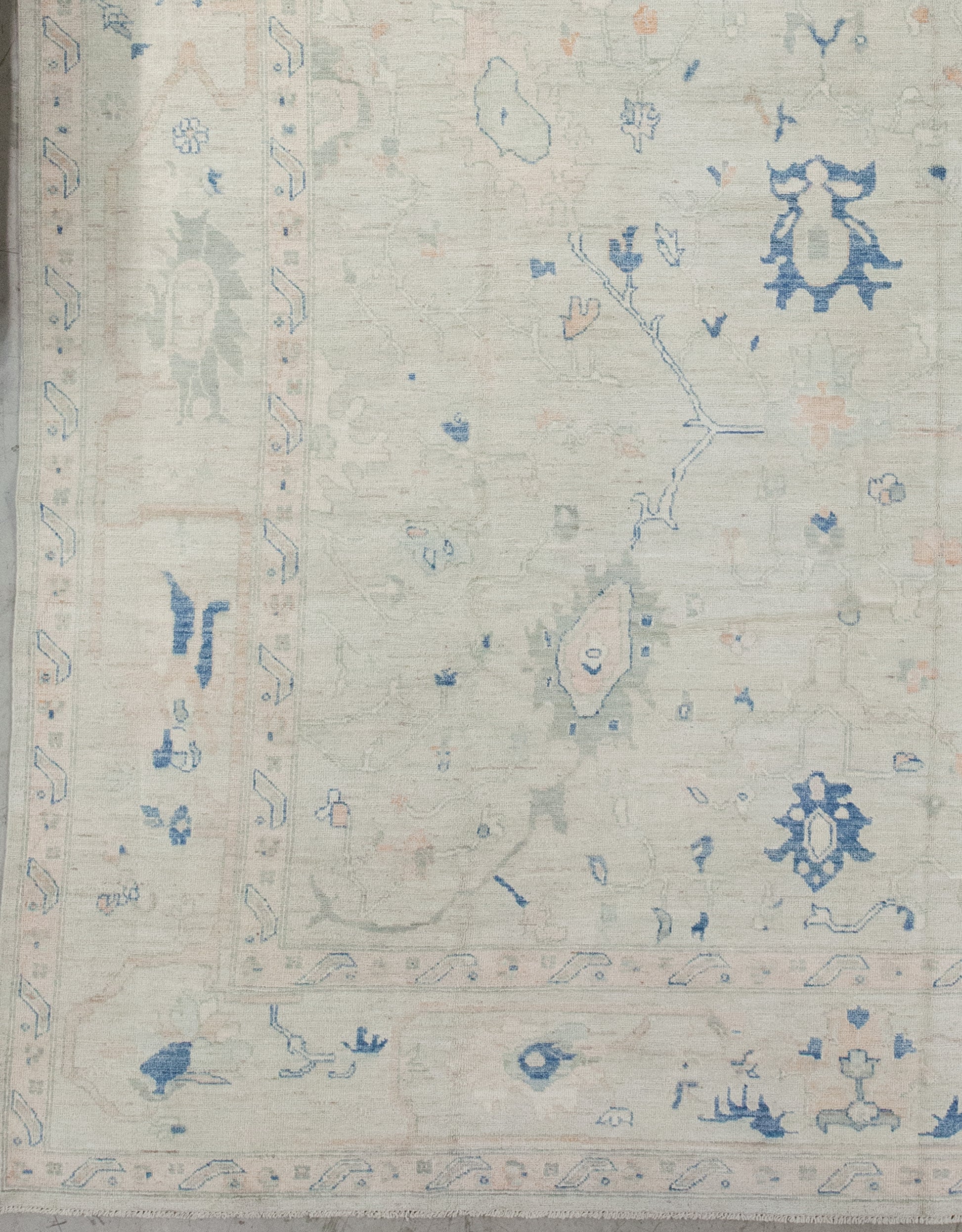 The design features abstract flowers over the whole carpet. From the lower corner to the entire perimeter, there are two thin borders holding a thick frame in between.