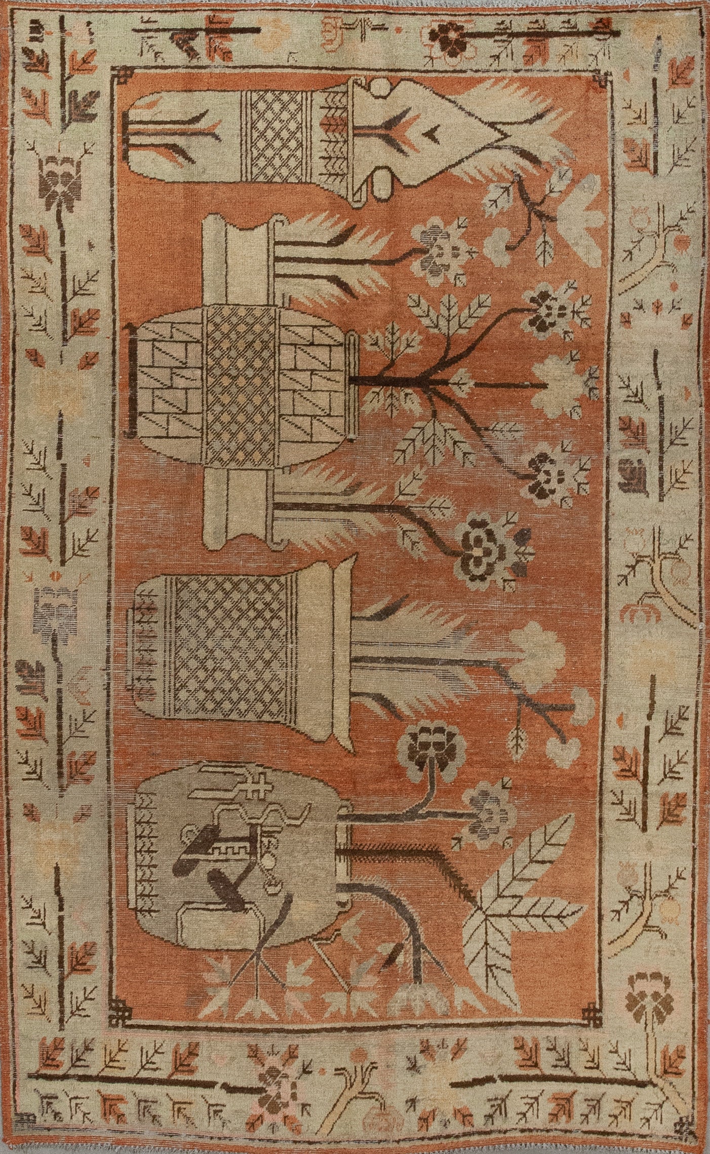 This creative carpet was woven with the pleasure that orange tone creates to the psyche. The composition features five large flowerpots over orange background.