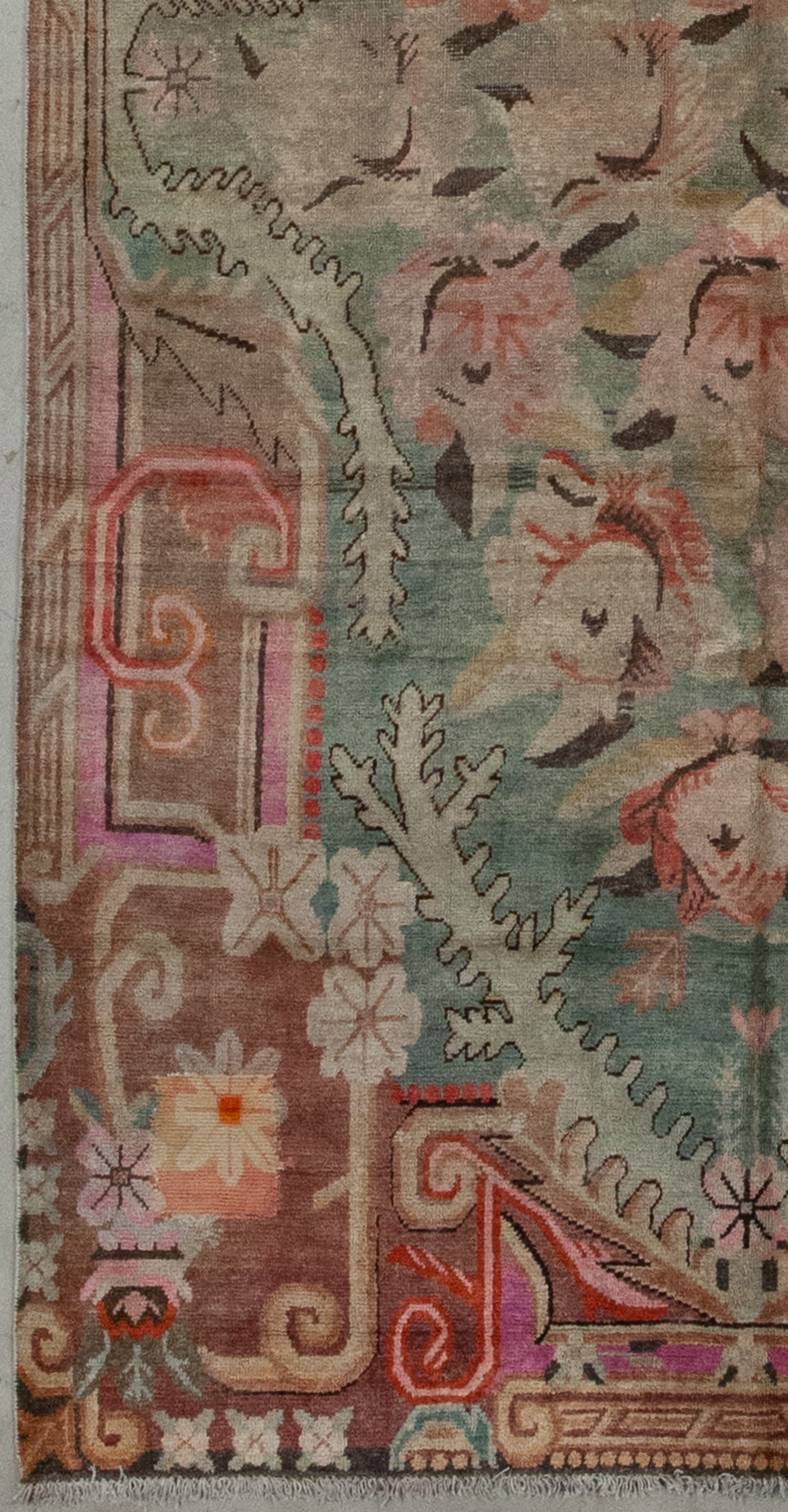 The entire perimeter features organic figures, flower heads, and ornaments.