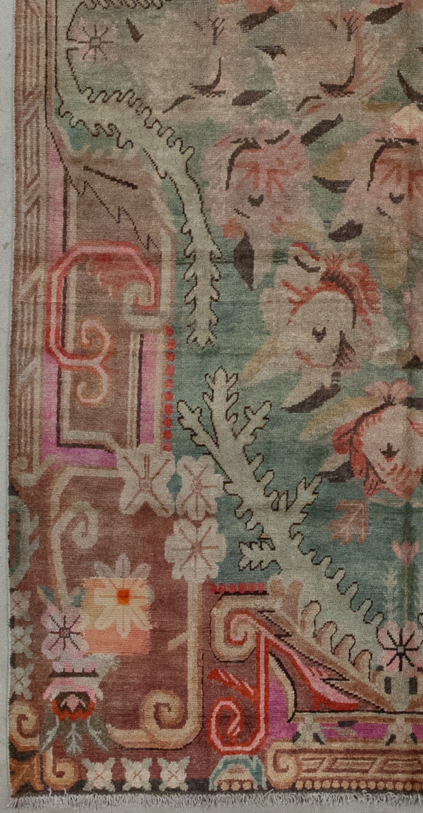 The entire perimeter features organic figures, flower heads, and ornaments.