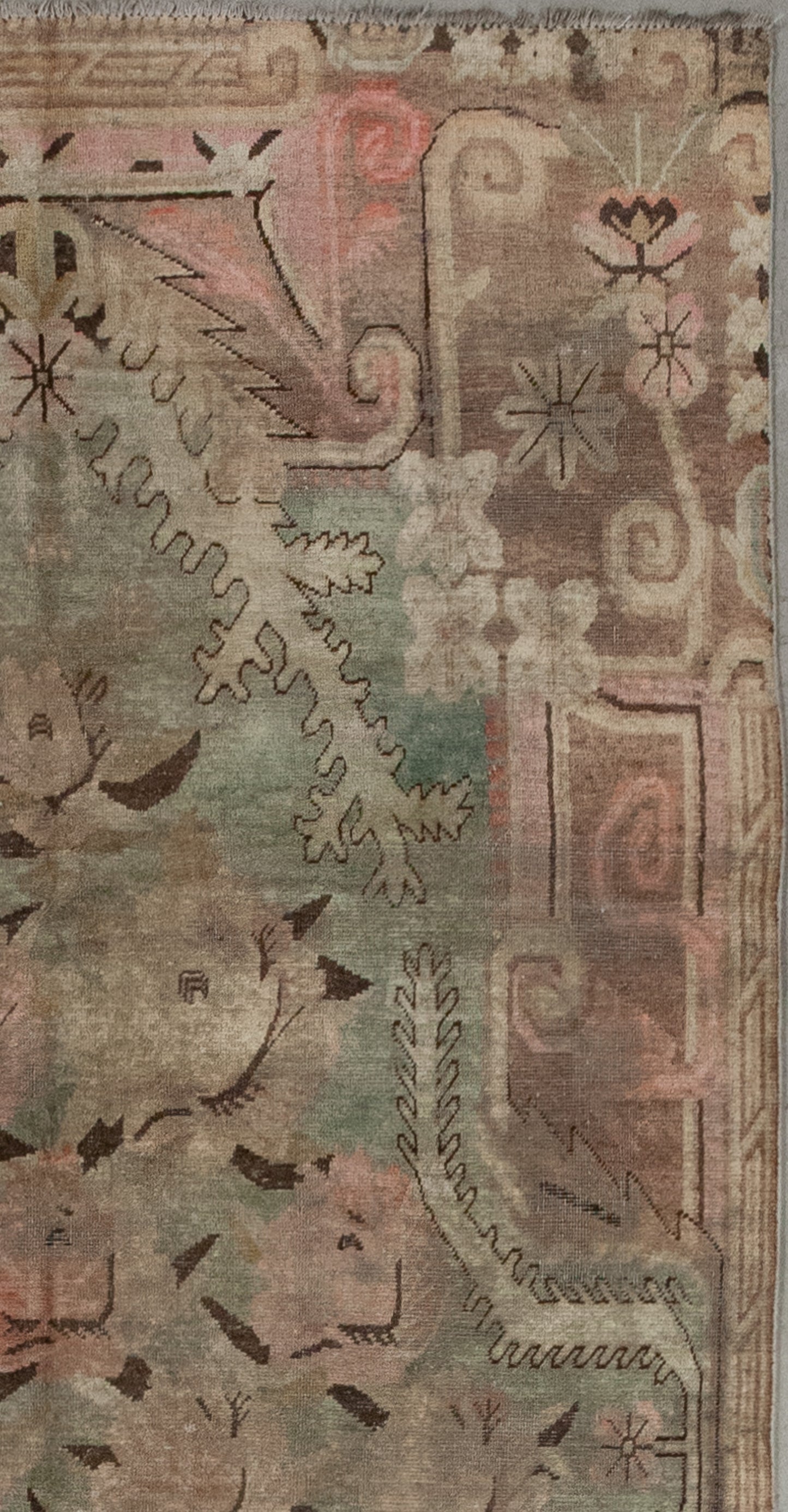 The color scheme comes with dusty greenish for the central background, pink for the main artwork, brown for the contour, and black and white to create contrast.