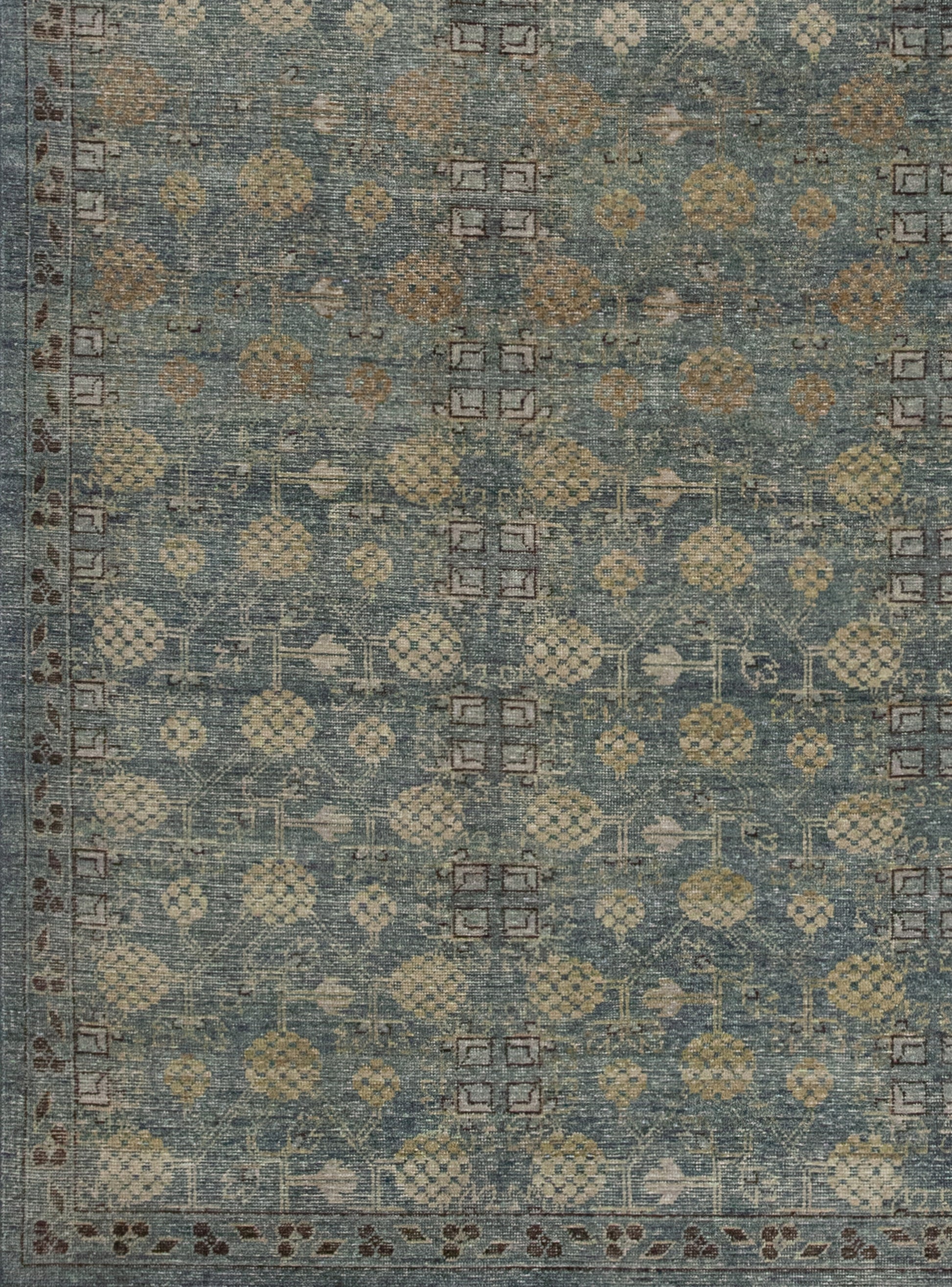 From the left bottom corner to every edge, there is a brown outlined thin border which contains brown leaves and rhombuses.
