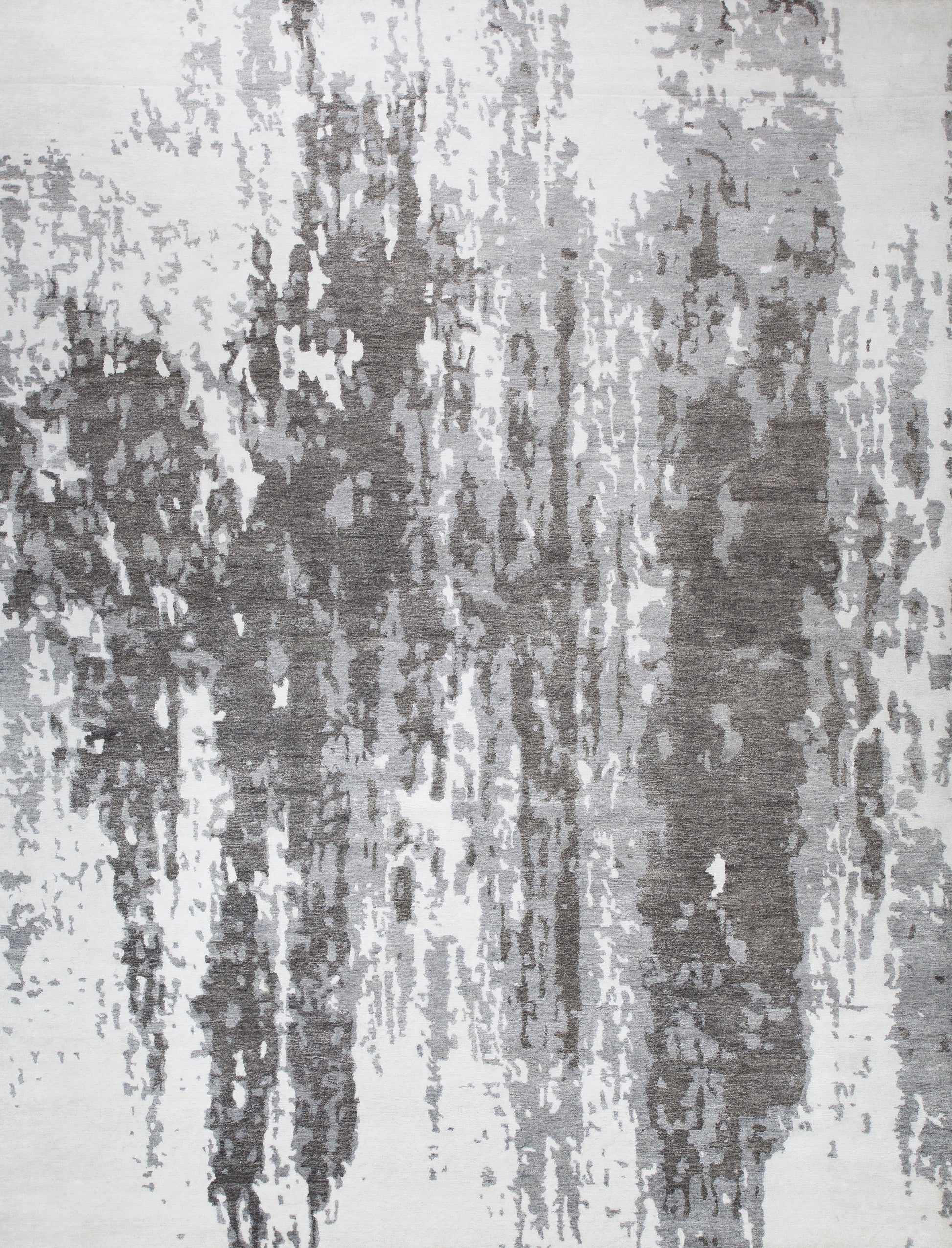 Creative modern rug comes with white background and a black urban design. The color scheme goes from white to gray escalating and finishing in dark gray.