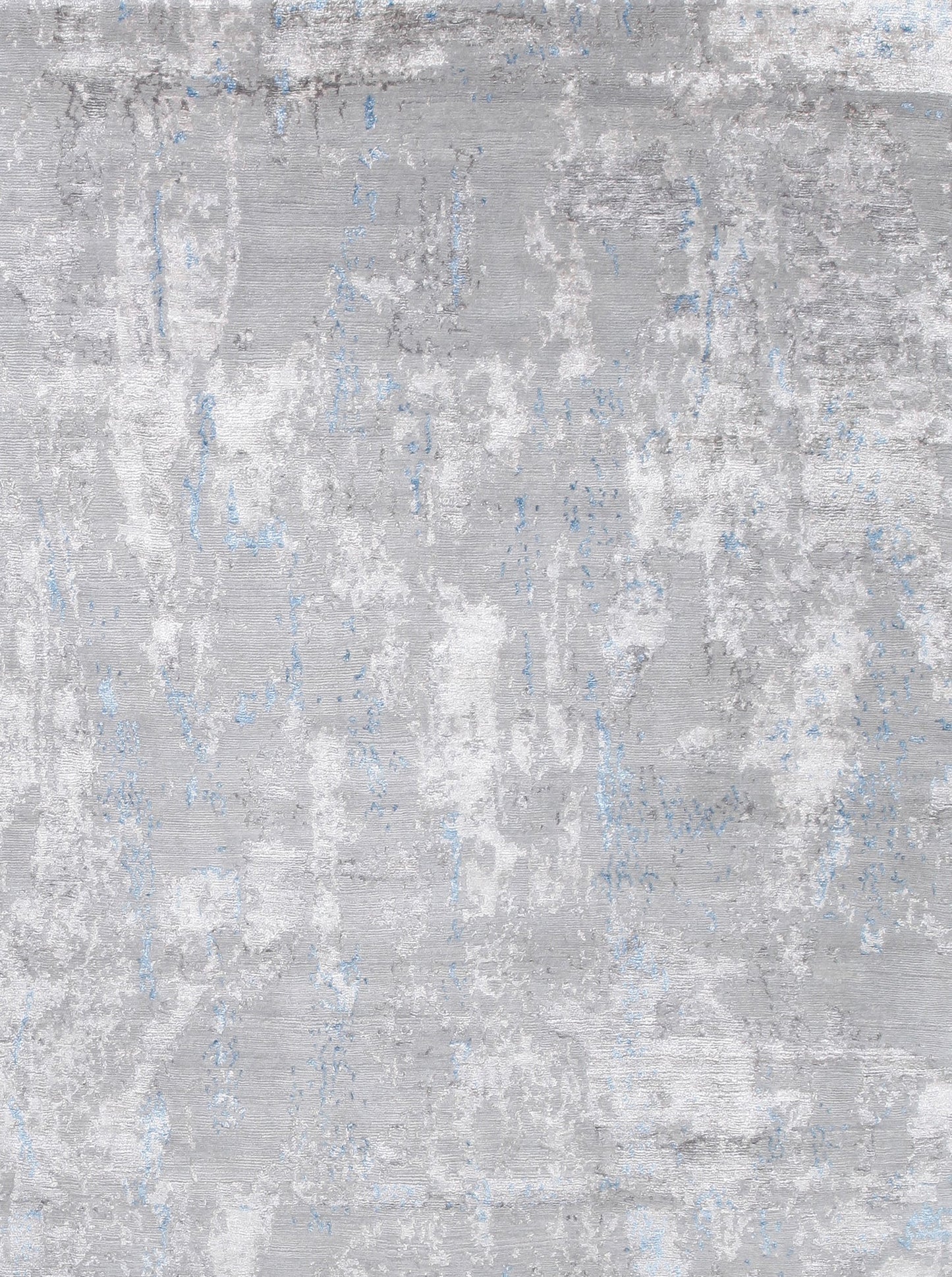 on the top right corner the abstract dark gray color design shows on all over the rug randomly.