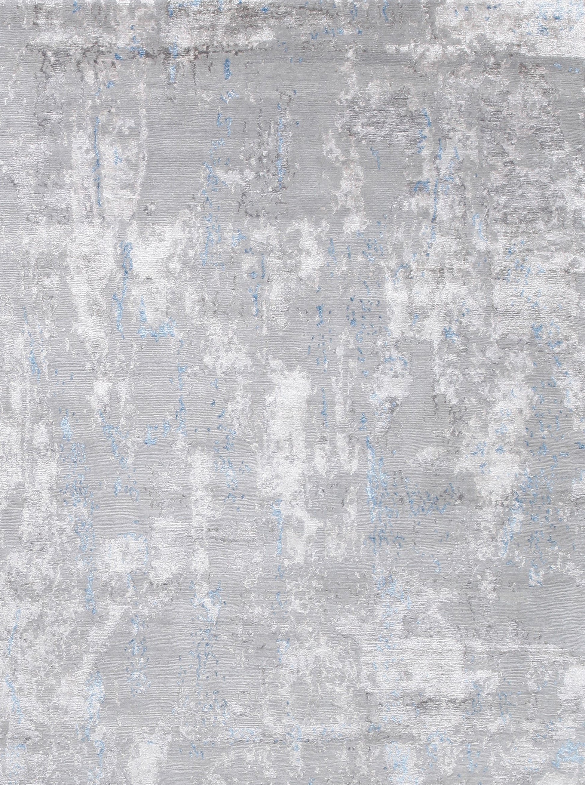 on the top right corner the abstract dark gray color design shows on all over the rug randomly.