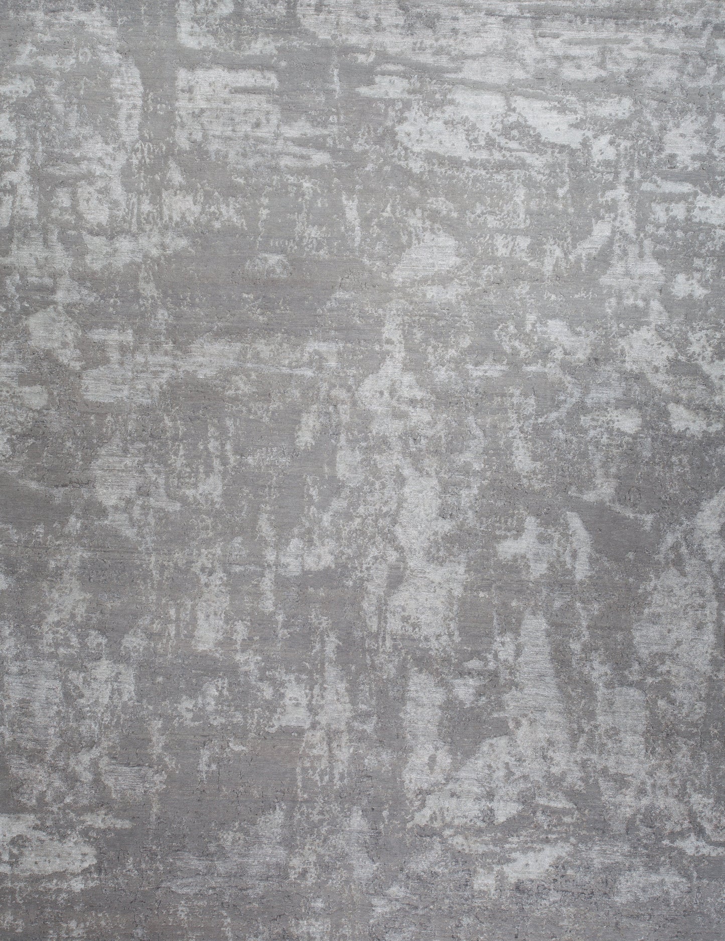 Contemporary rug with an abstract design all over the rug. The light color scheme goes from light gray through dark gray, which makes this rug a great home statement.