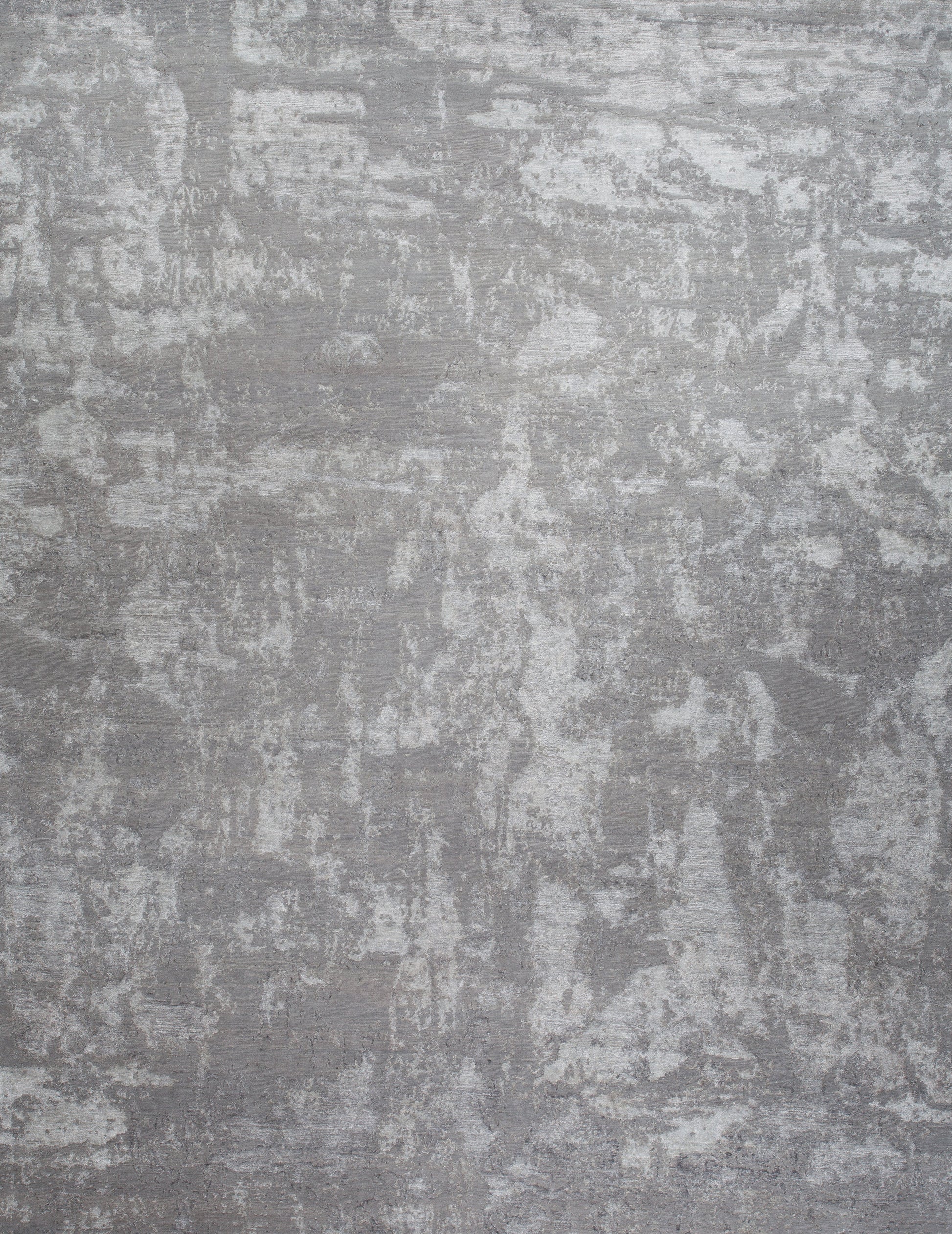 Contemporary rug with an abstract design all over the rug. The light color scheme goes from light gray through dark gray, which makes this rug a great home statement.