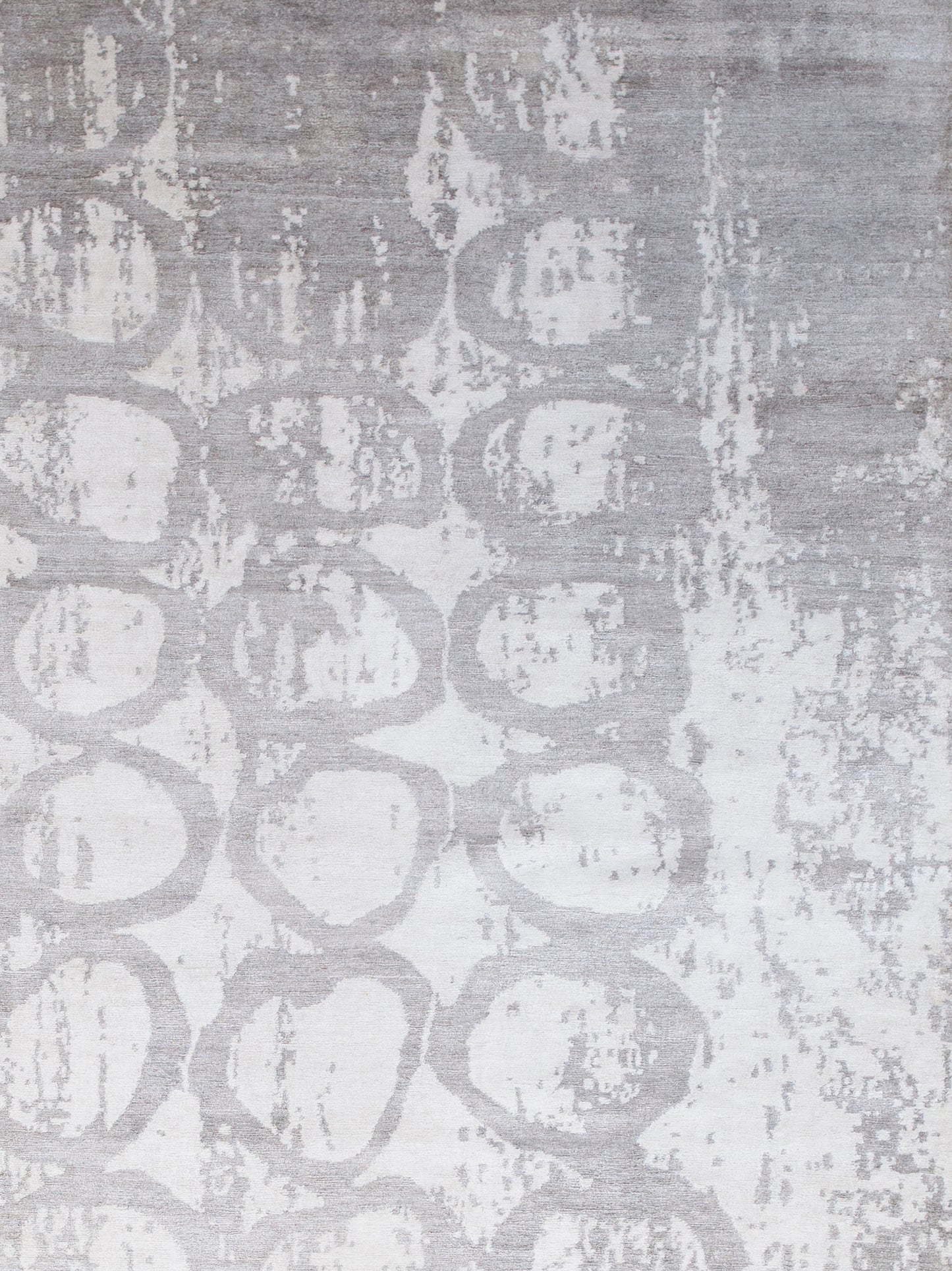 On the top right corner, the worn out design covers the rings composition partially.