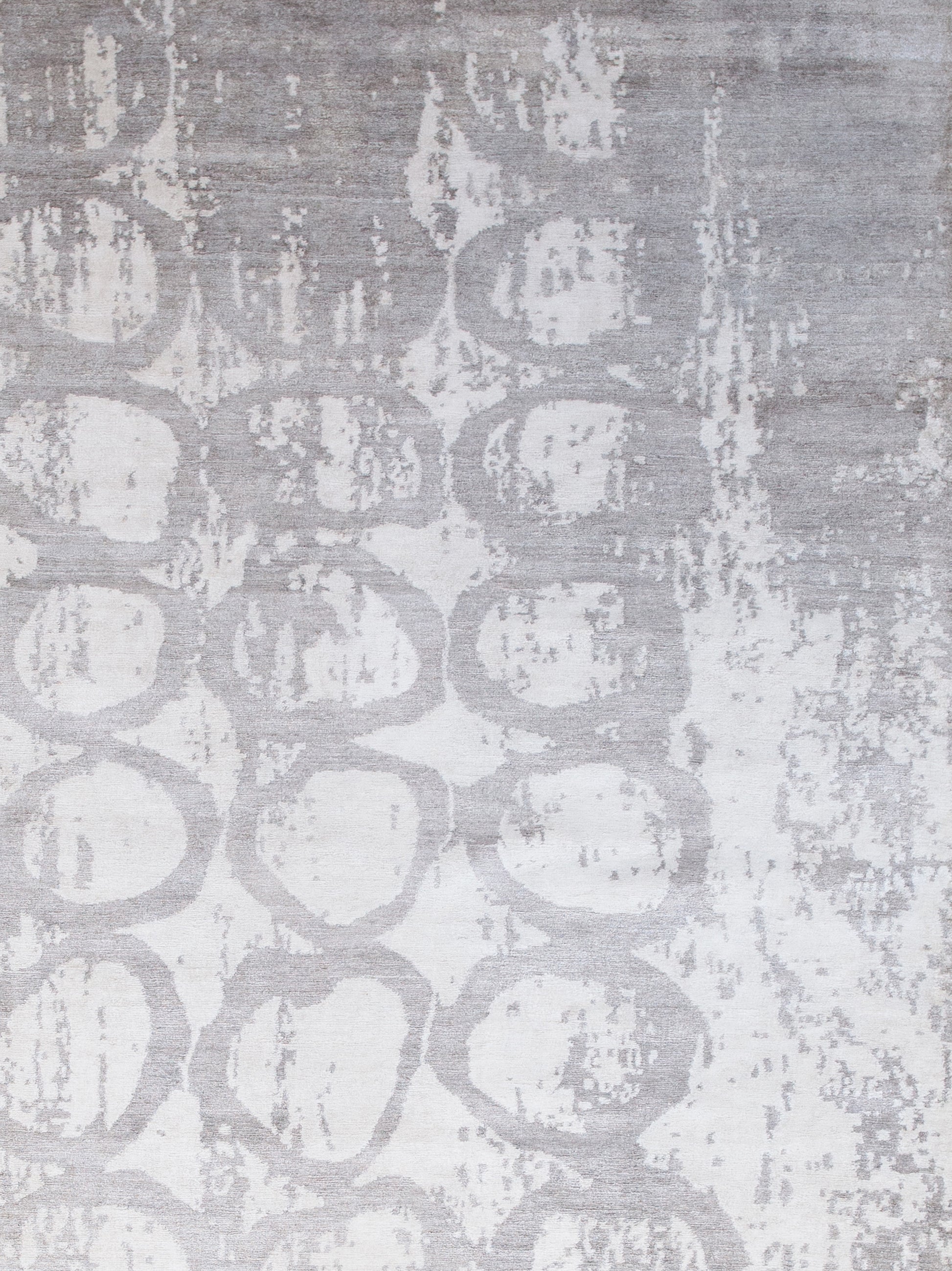 On the top right corner, the worn out design covers the rings composition partially.