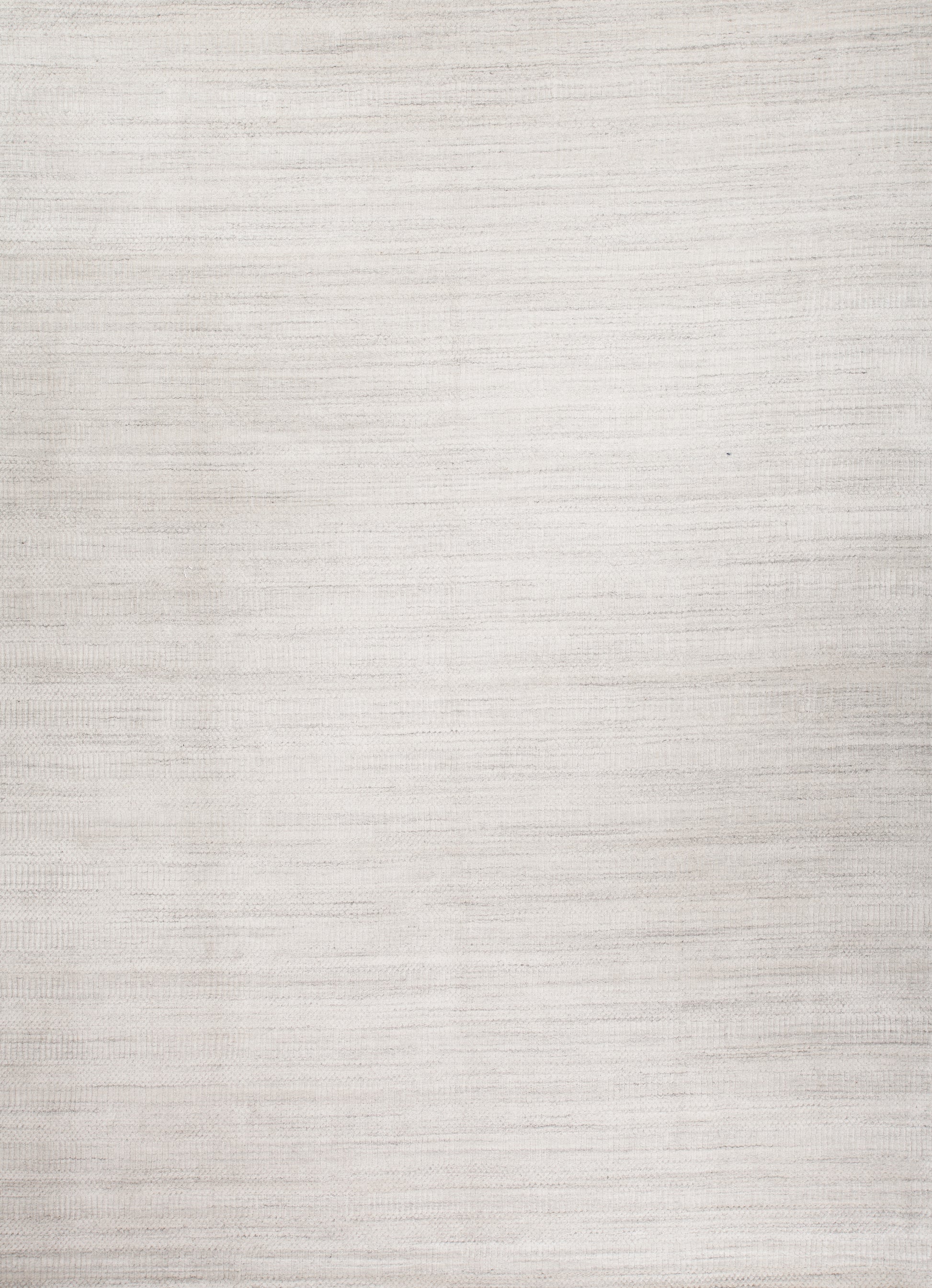 A white carpet is elegant, simple, and a pleasure to be held on. This modern rug is hand knotted to be placed in any room that you want to enlighten. Since white rugs will always bring positive energy to your room, it's always a smart option to choose from.