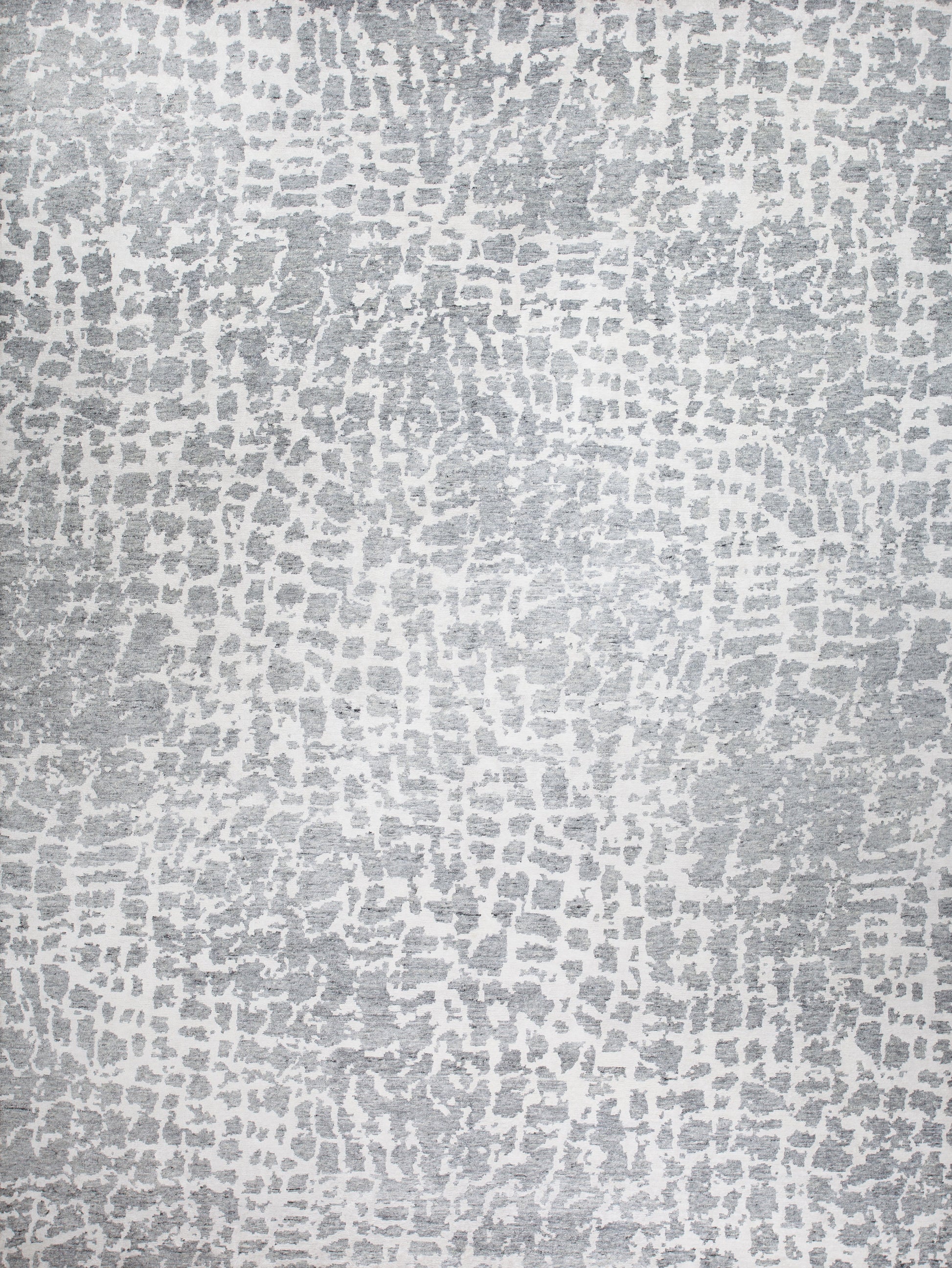 Modern rug comes with a gray spot pattern over white background.