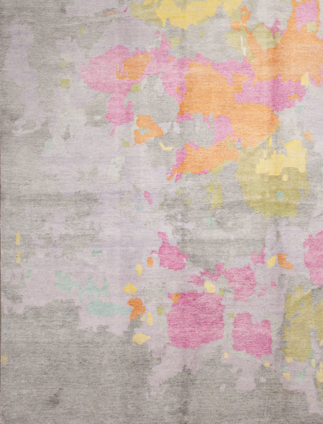 The background of the rug is gray with multicolor design on top.