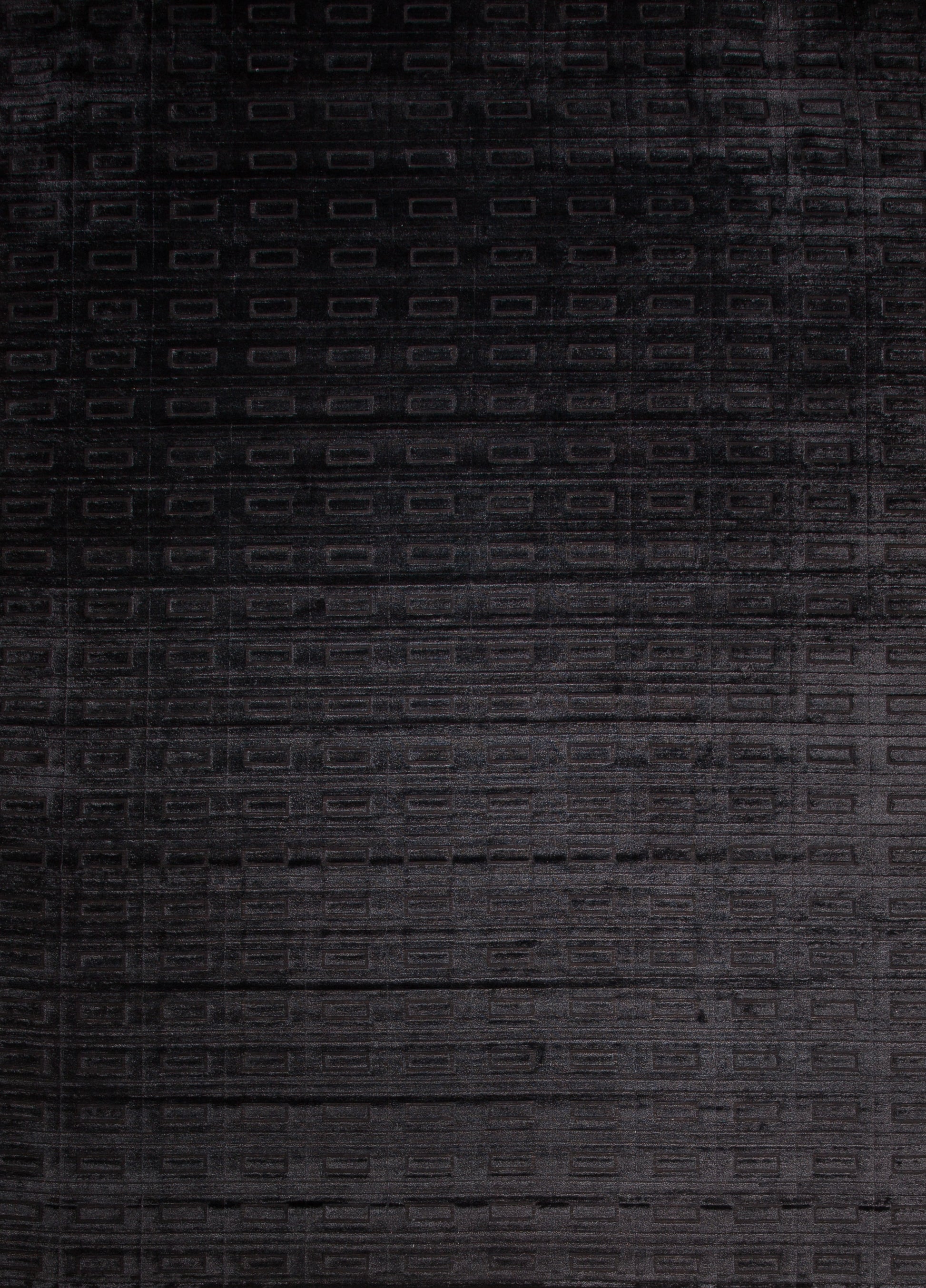 Modern black carpet comes with a brick pattern, and its contemporary design is geometrical, organized, and great for any office or reception area.
