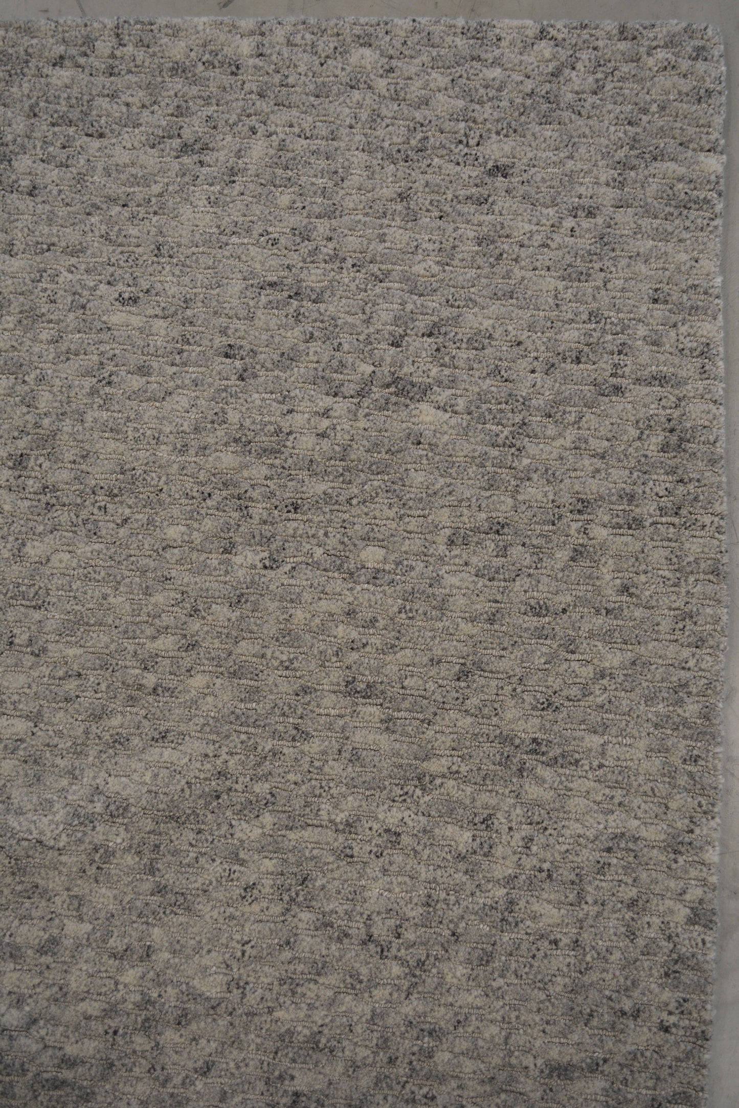 On the top right corner, the same pattern is consistent all over the rug which doesn't have any frames or borders.