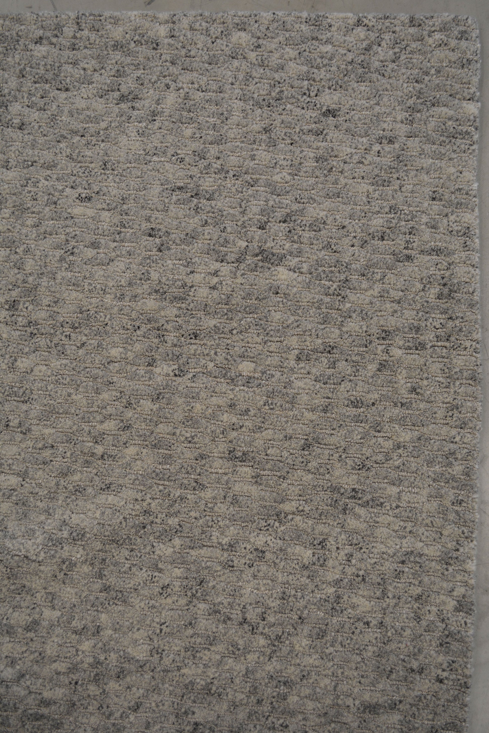 On the top right corner, the same pattern is consistent all over the rug which doesn't have any frames or borders.