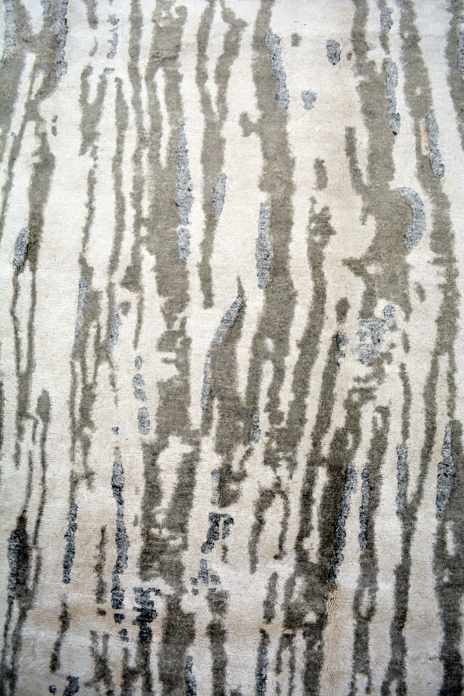 The center's close up displays the water fall vertical lines creating a kind contrast with the white background.