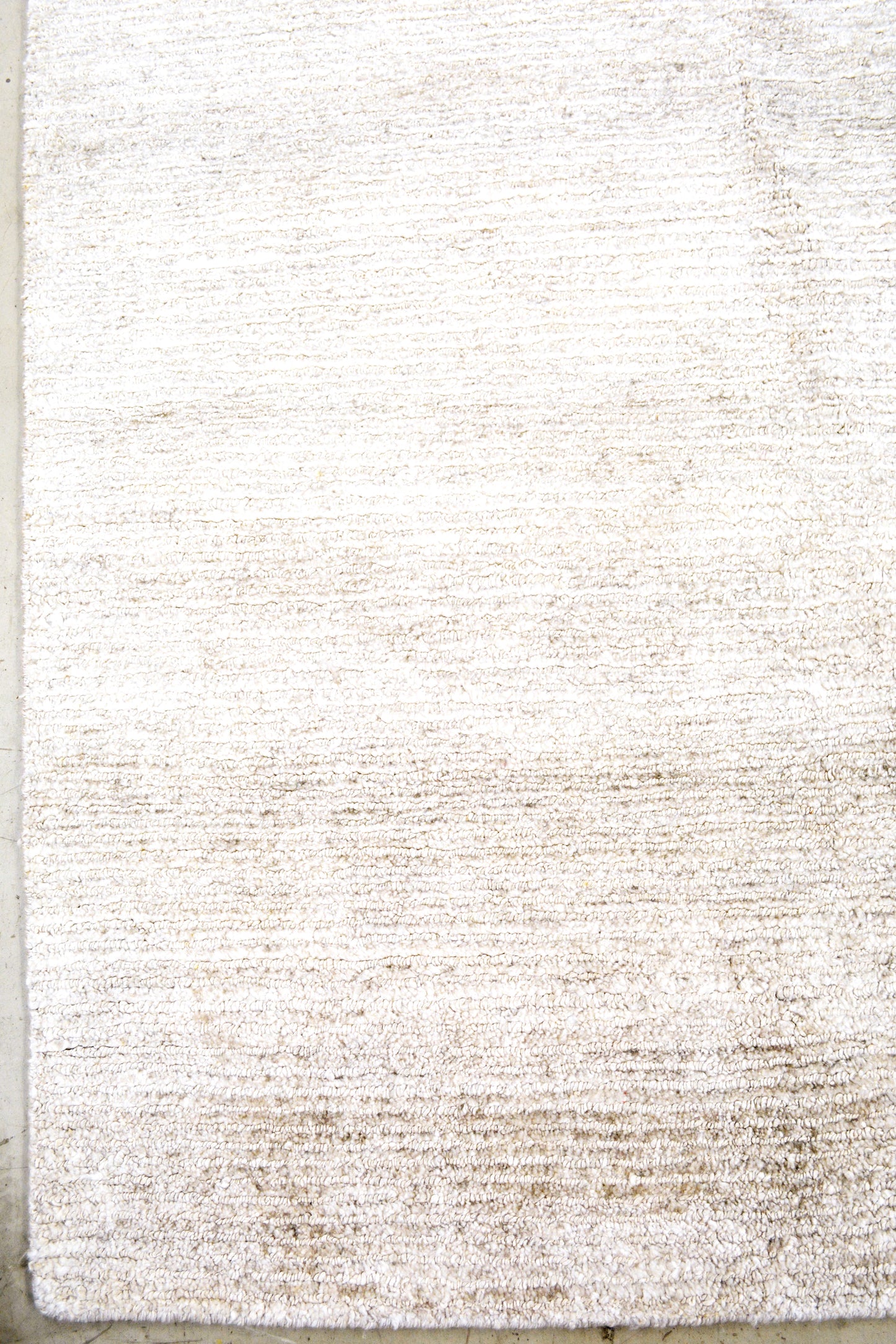 On the bottom left corner, there aren't frames or borders for this simplistic rug.