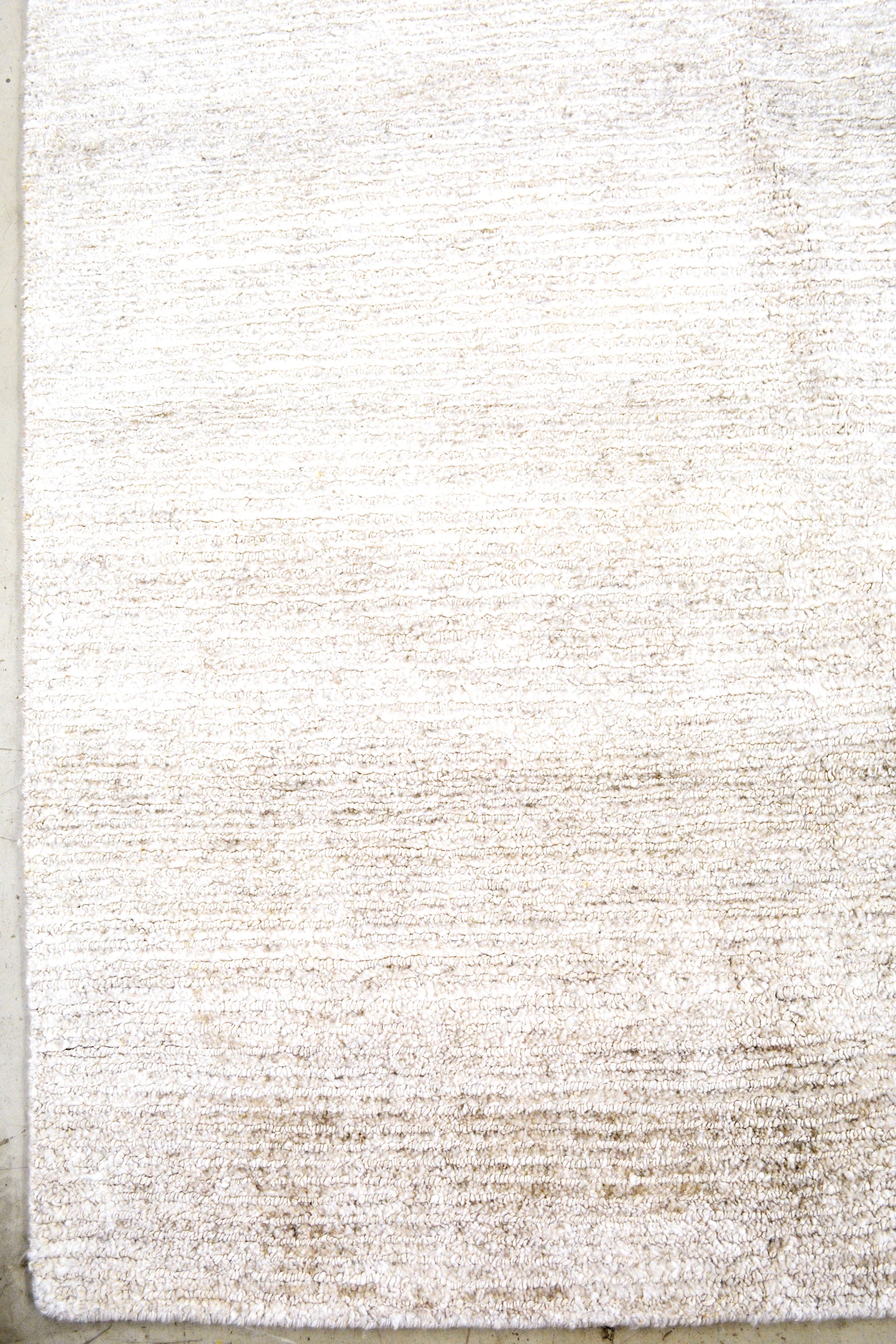 On the bottom left corner, there aren't frames or borders for this simplistic rug.