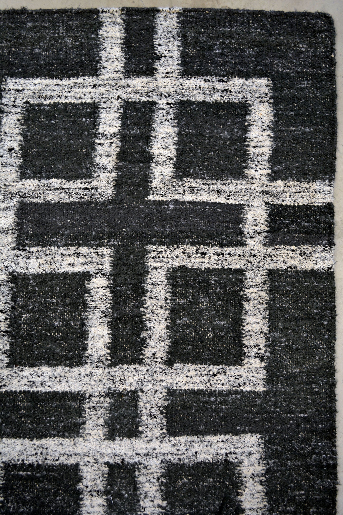 On the top right corner, there is a main square with more squares on every corner creating a cross in the middle.