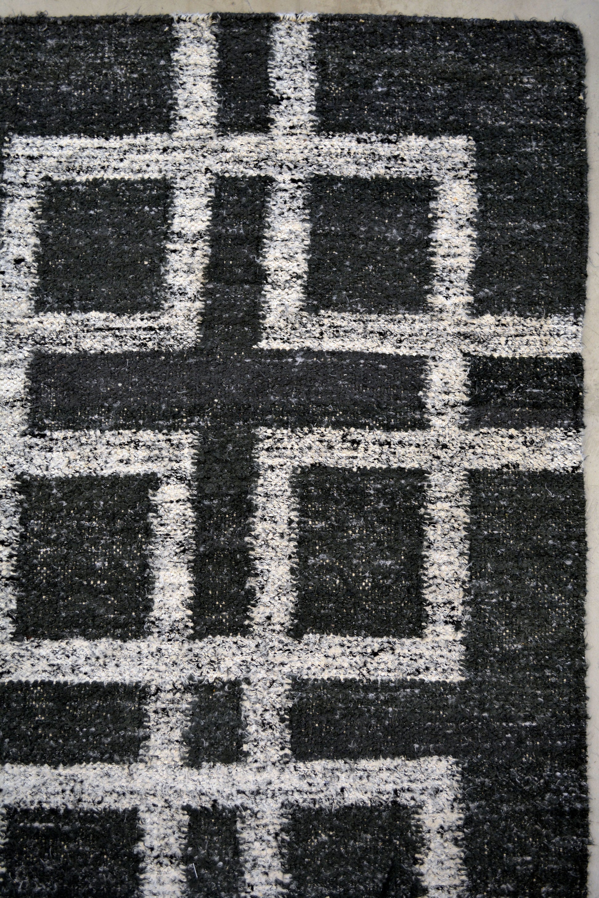 On the top right corner, there is a main square with more squares on every corner creating a cross in the middle.