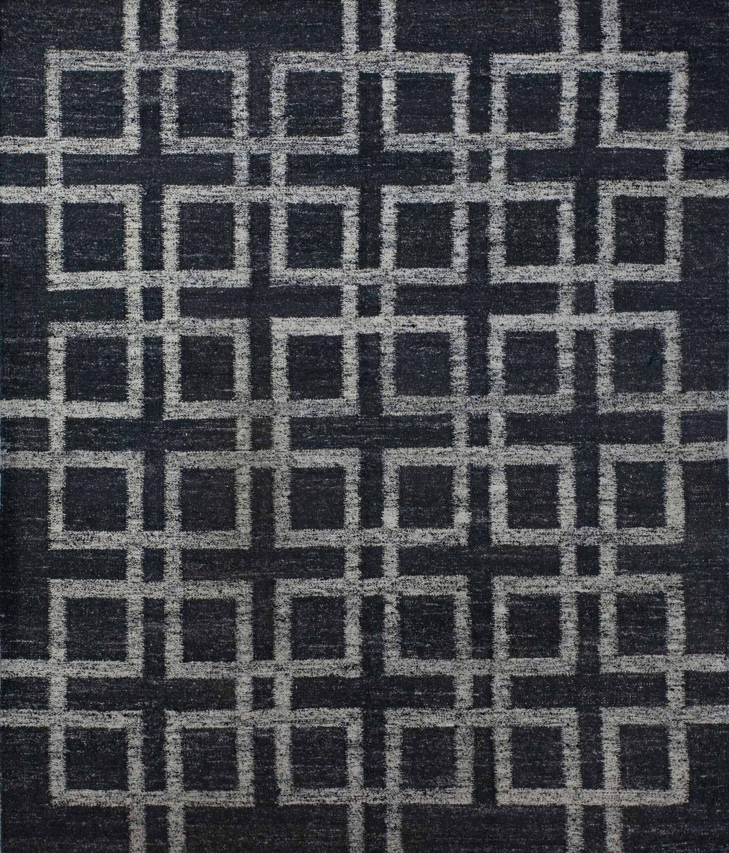 Contemporary carpet comes with black background and an overlapping white outlined square pattern which renders symmetrically. This rug is great for the business lobby because it brings the vibes of order, target, and goals.