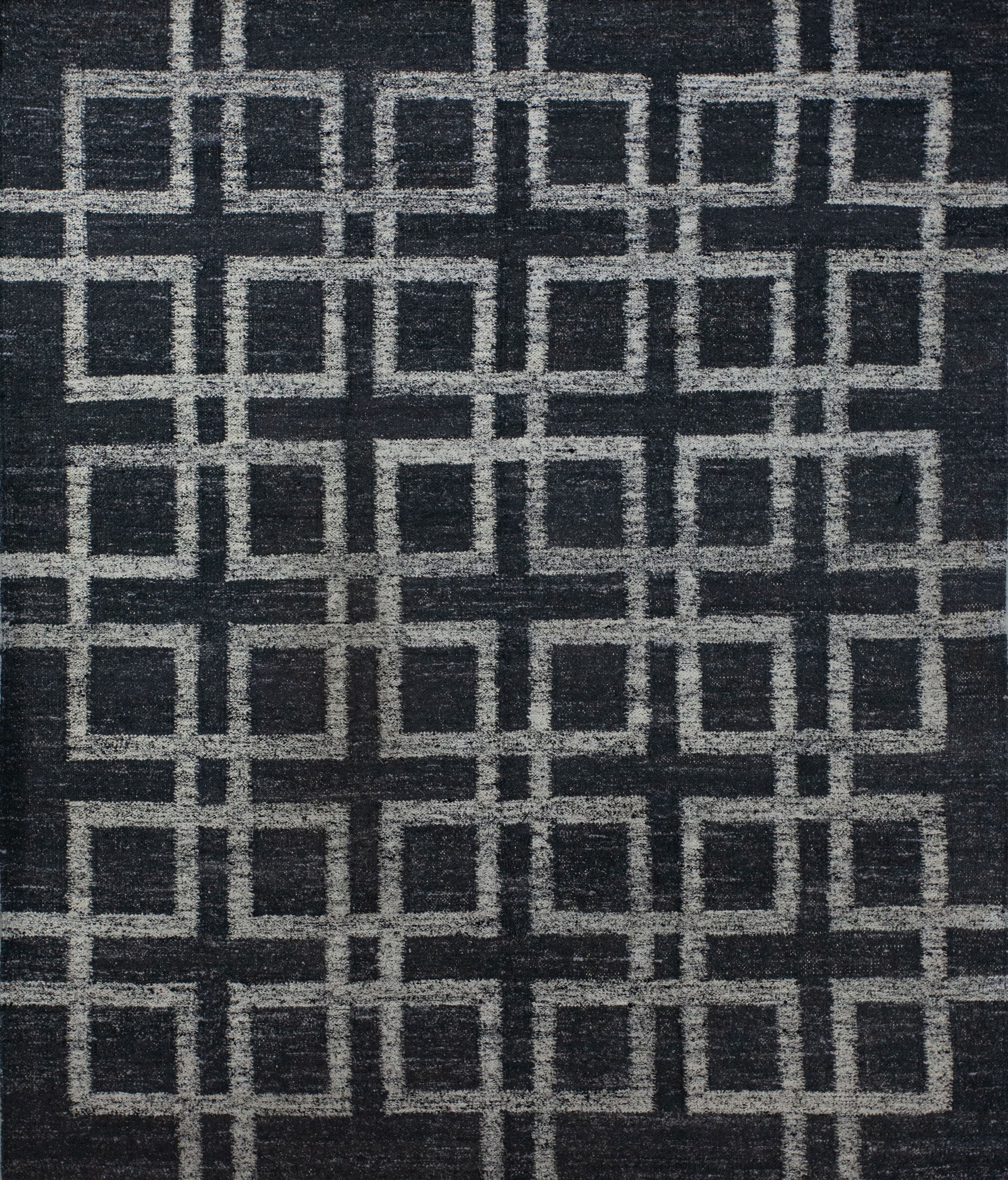 Contemporary carpet comes with black background and an overlapping white outlined square pattern which renders symmetrically. This rug is great for the business lobby because it brings the vibes of order, target, and goals.
