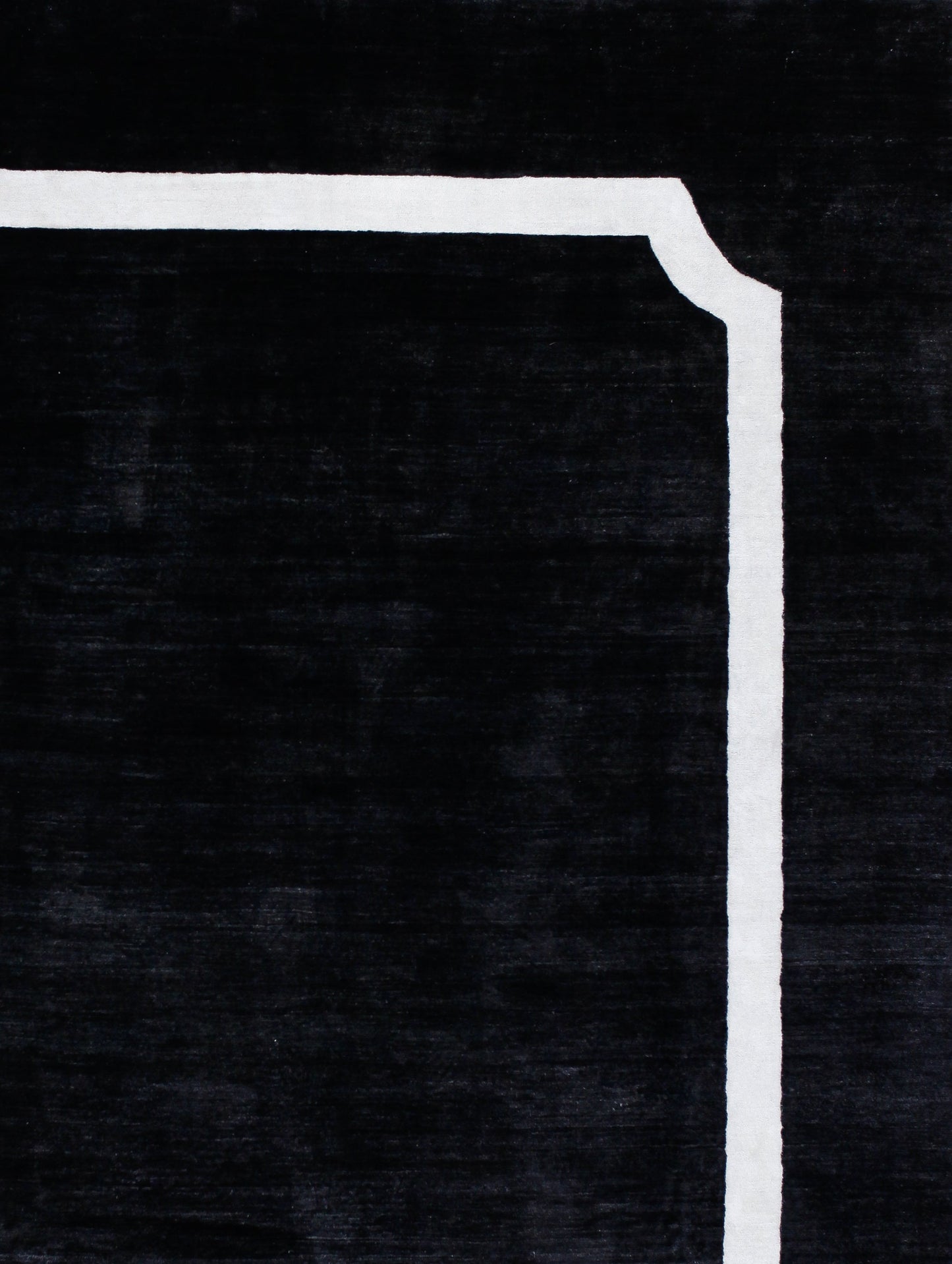 On the top right corner, there is a white solid frame with an inverse rounded corner.