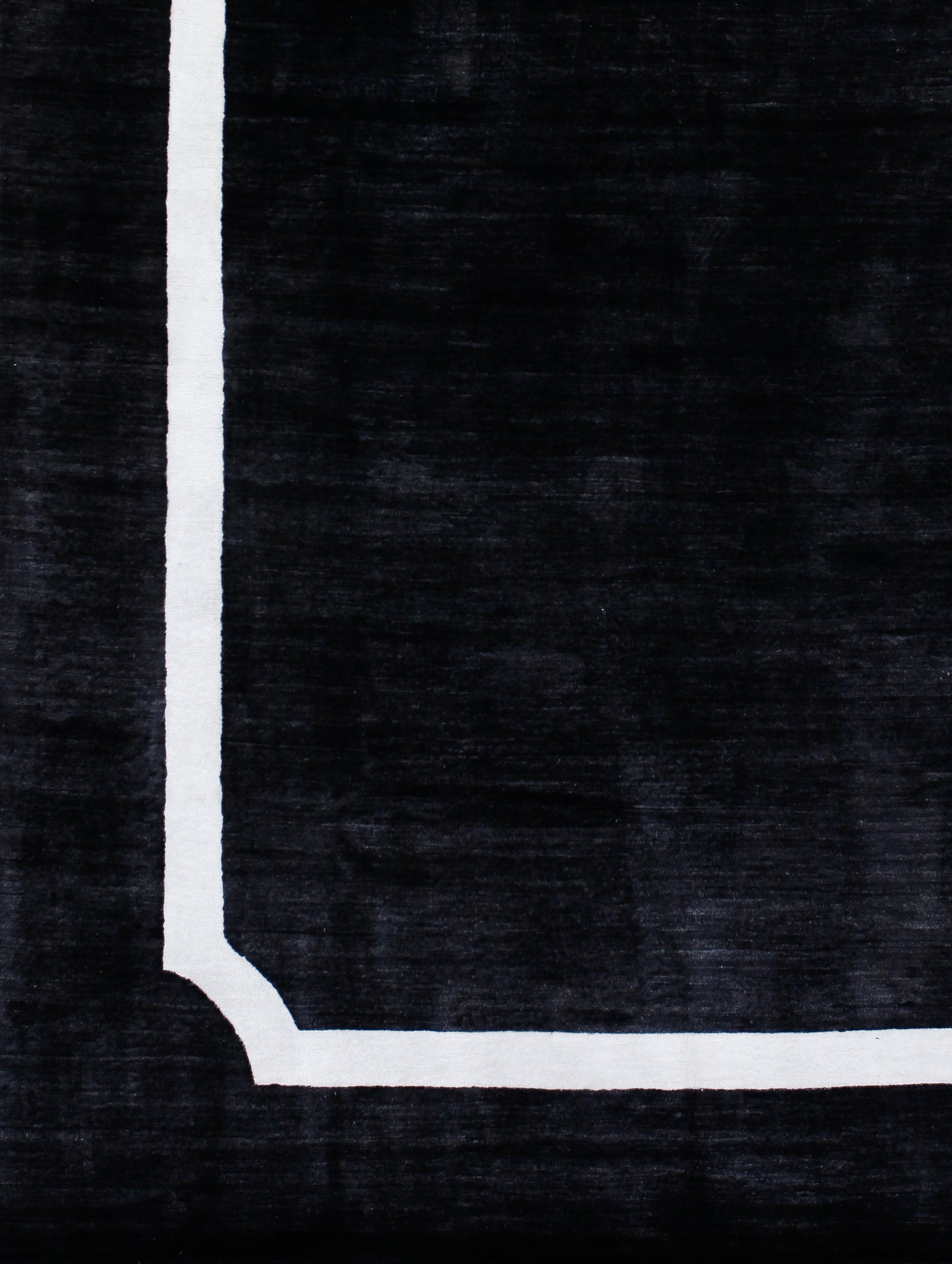 On the bottom left corner, there is a black border and inside of it there is the frame.