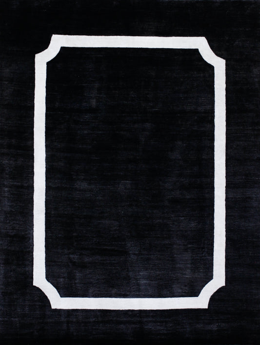 The greatness of this carpet relies on the simplicity of the design. Ryan brings this nice rug's design which is duo-tone; black background and white outline. This modern rug has a white thin frame with inverse rounded corners.