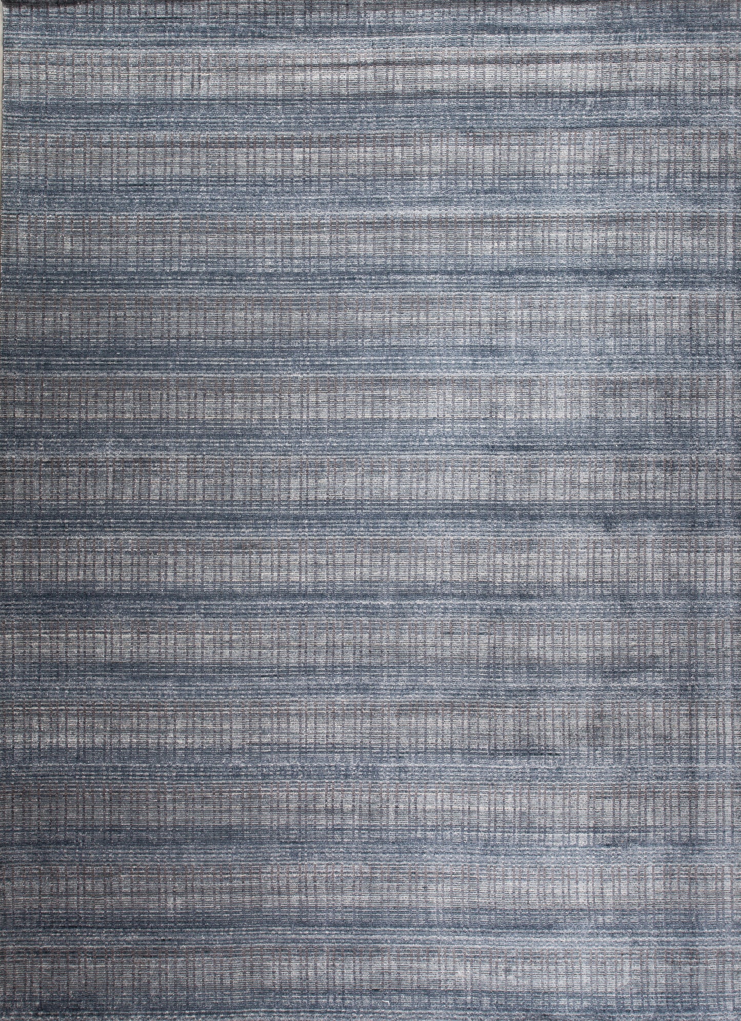 This modern youthful carpet comes with a very cool jeans pattern, and it's a nice option for a teenager room. The horizontal knitted pattern is in navy blue while vertical lines are in light gray tones.