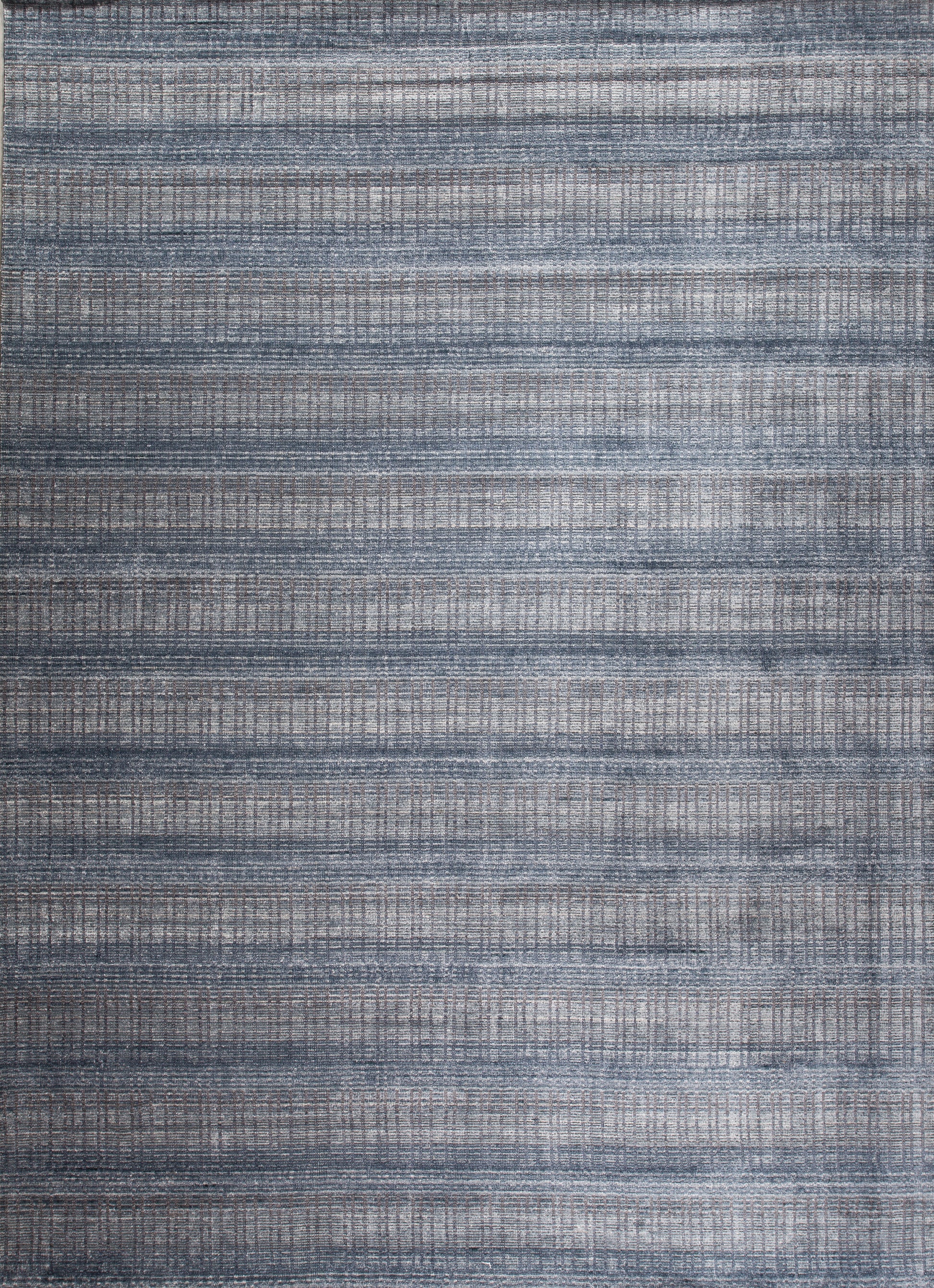 This modern youthful carpet comes with a very cool jeans pattern, and it's a nice option for a teenager room. The horizontal knitted pattern is in navy blue while vertical lines are in light gray tones.
