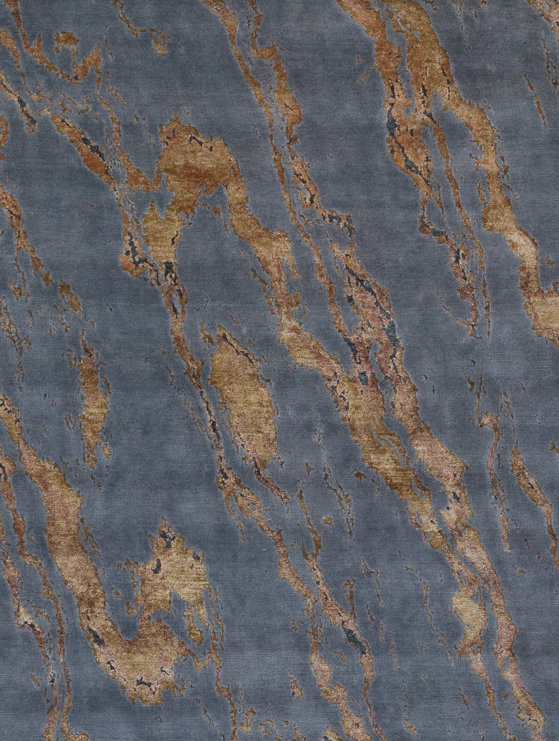 the close up of the center of the rug renders the pretty golden details of the knots.