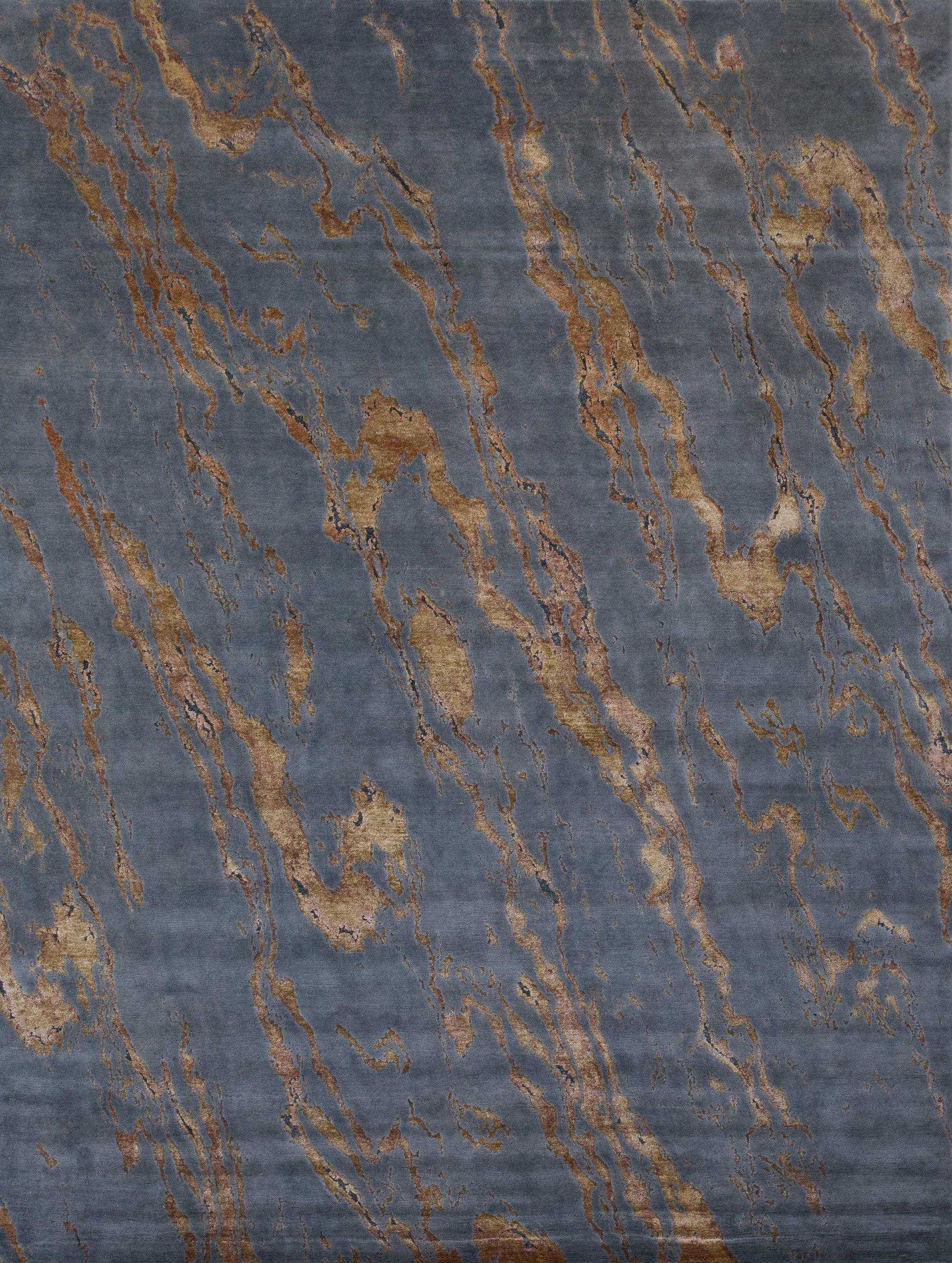 Modern rug with dark gray background and a golden marble pattern on top.