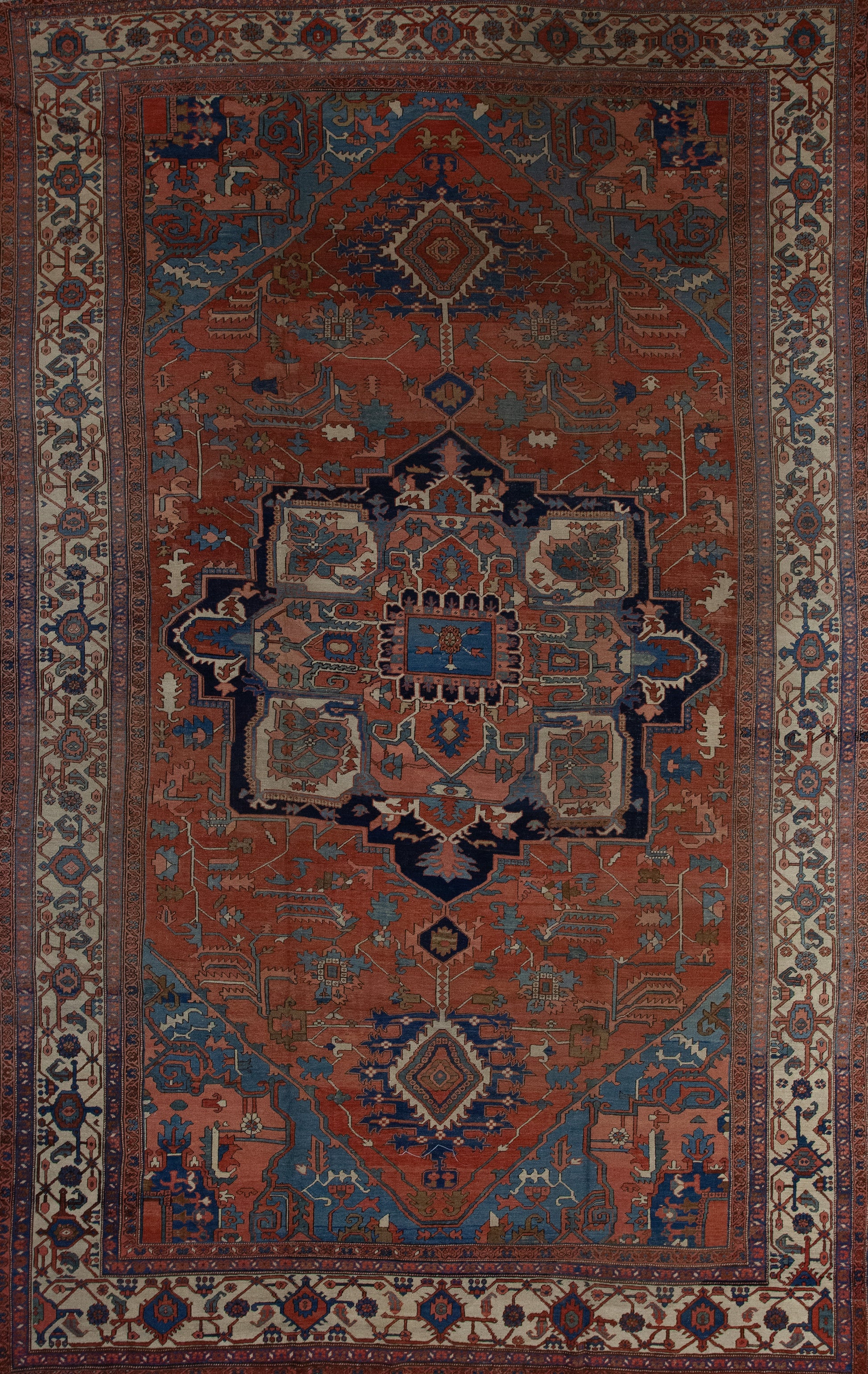Antique carpet has a brown background which is the dominant color, and the center features an interesting artwork which creates an eight points star. 