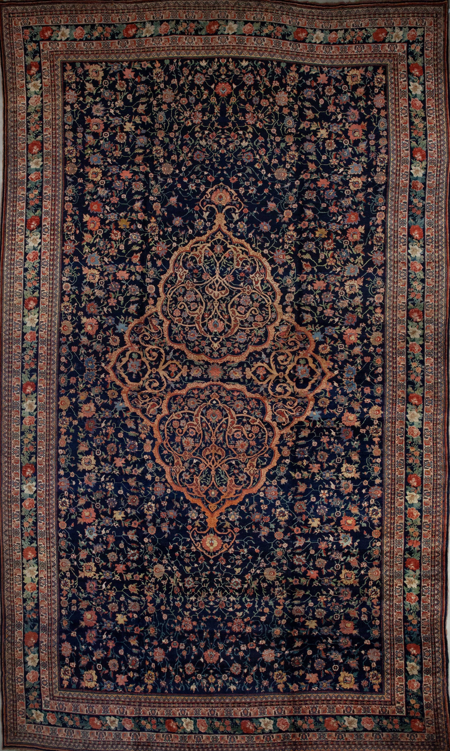 Monumental rug comes with the traditional multiple borders and frames from the antique style. The color palette has red, green, yellow, white, and blue as the dominant tone. 