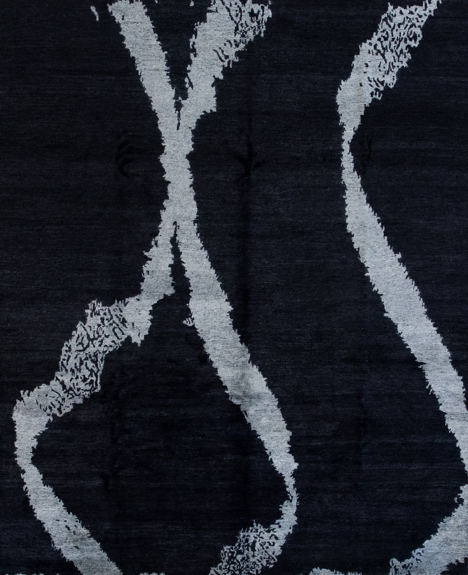 Modern rug comes with black background and an abstract design. Our cloud collection holds this carpet which comes in black and silver, and it is perfect for your reception area.
