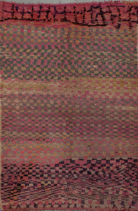 Vintage rug with a square pattern in yellow and pink tones, gray, and black to create contrast.