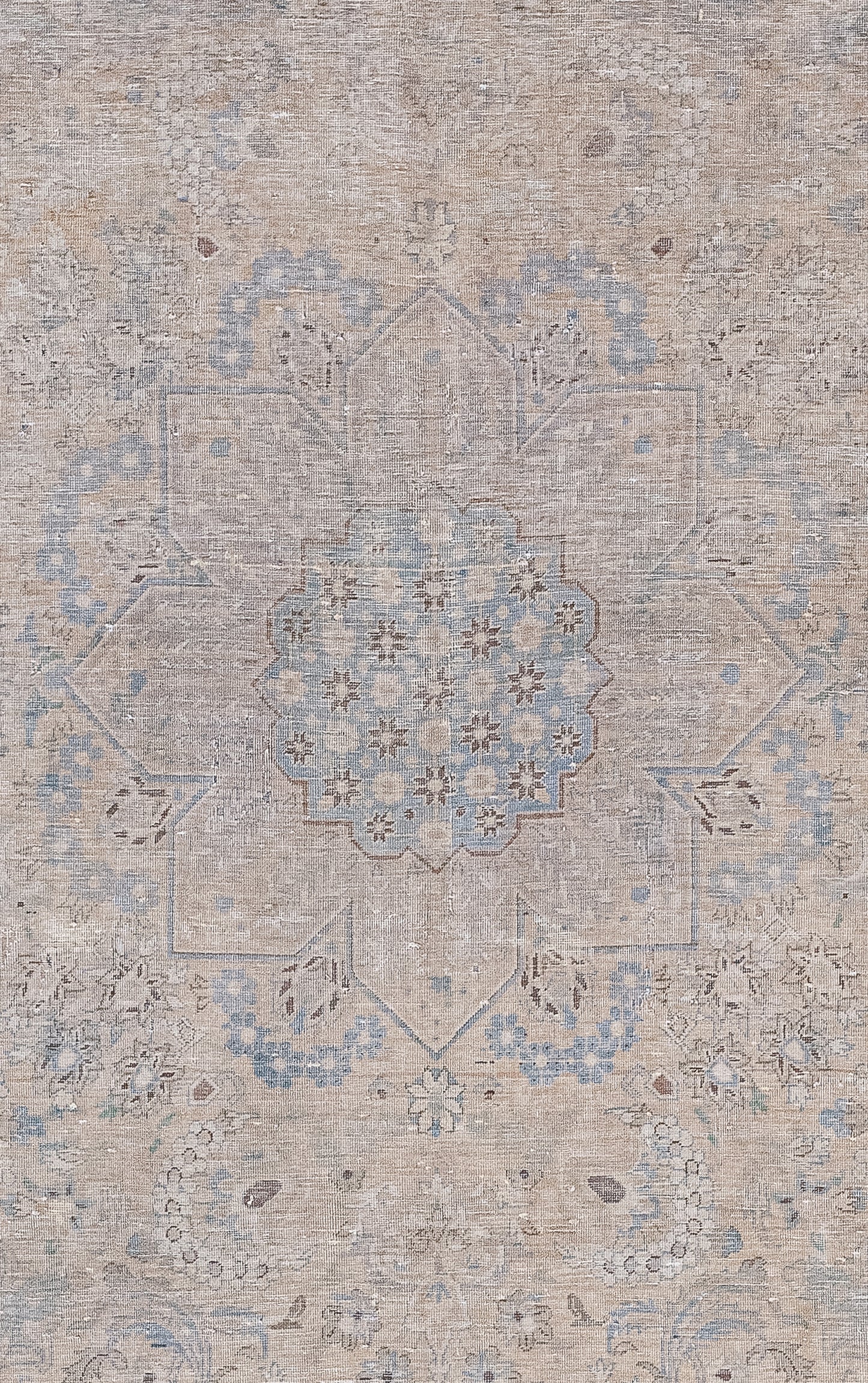 The center of the rug features a large mandala with a nested one filled with tiny flowers at the top.