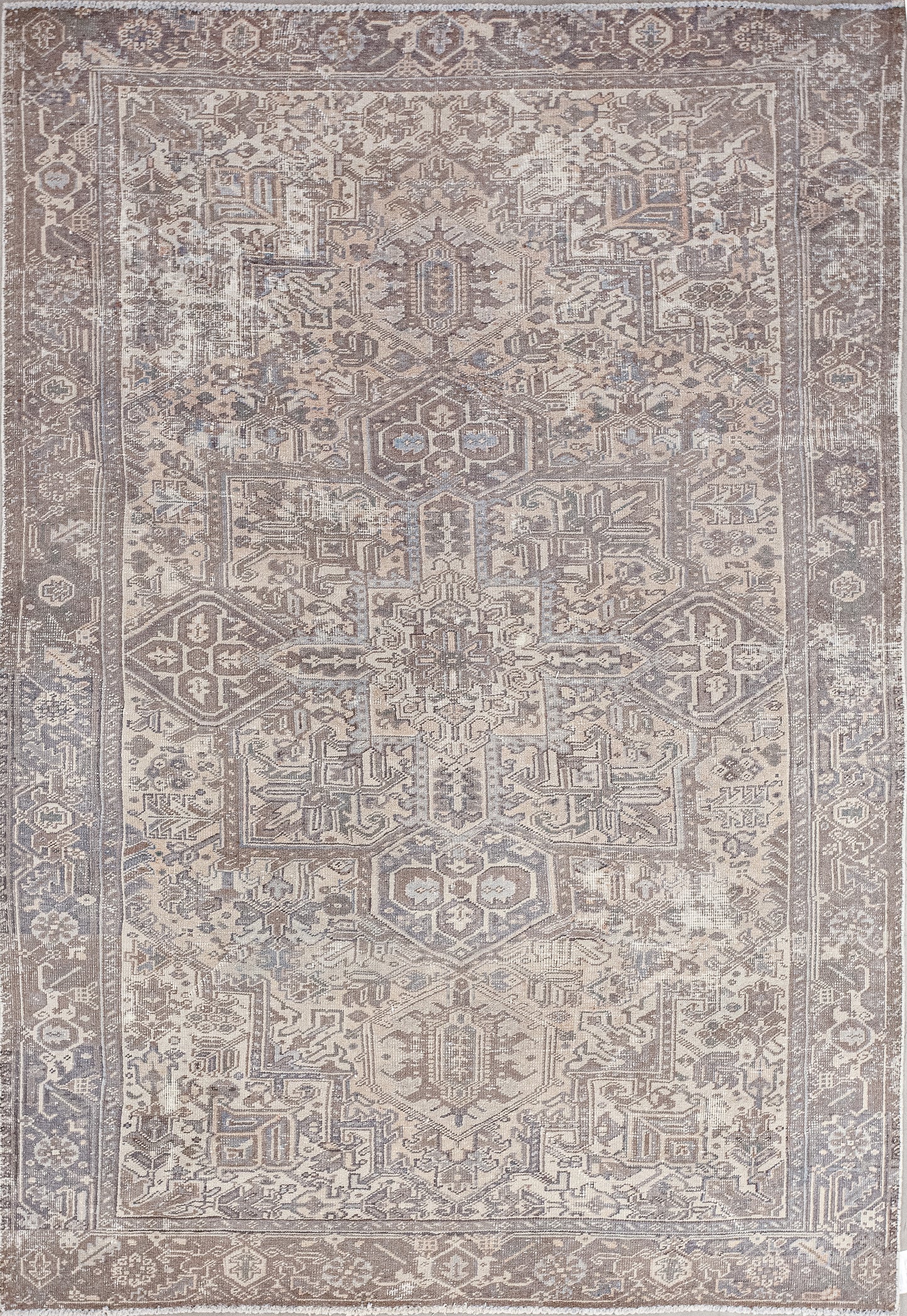 A strange carpet was woven with the decoration of a tribal temple. The color palette of the wood has variations of brown and some reflections of gray. 