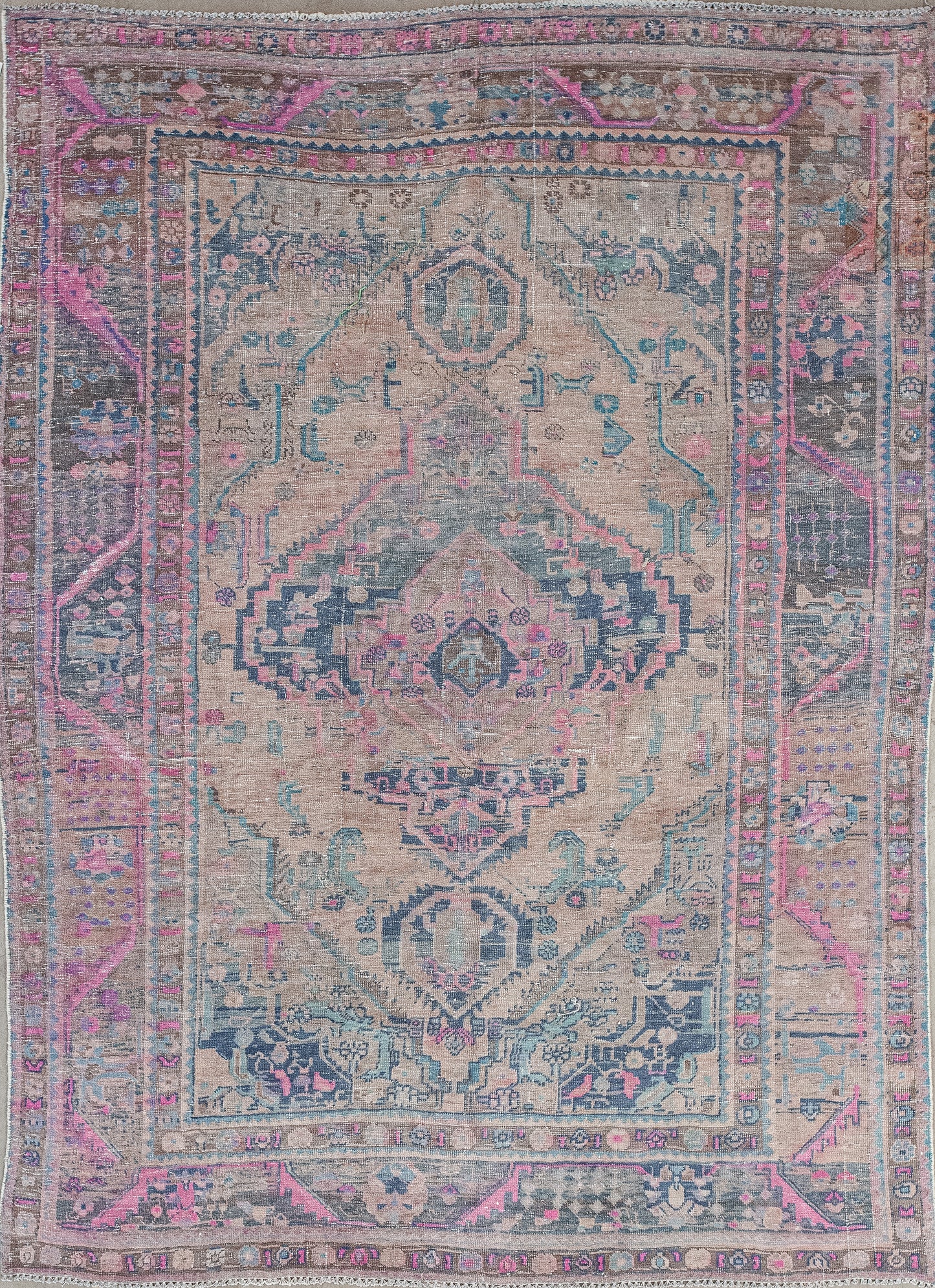 This feminine carpet was woven to attract love and kindness into your space. The mixed palette comes with pink, green, gray, and mostly beige for the central background.