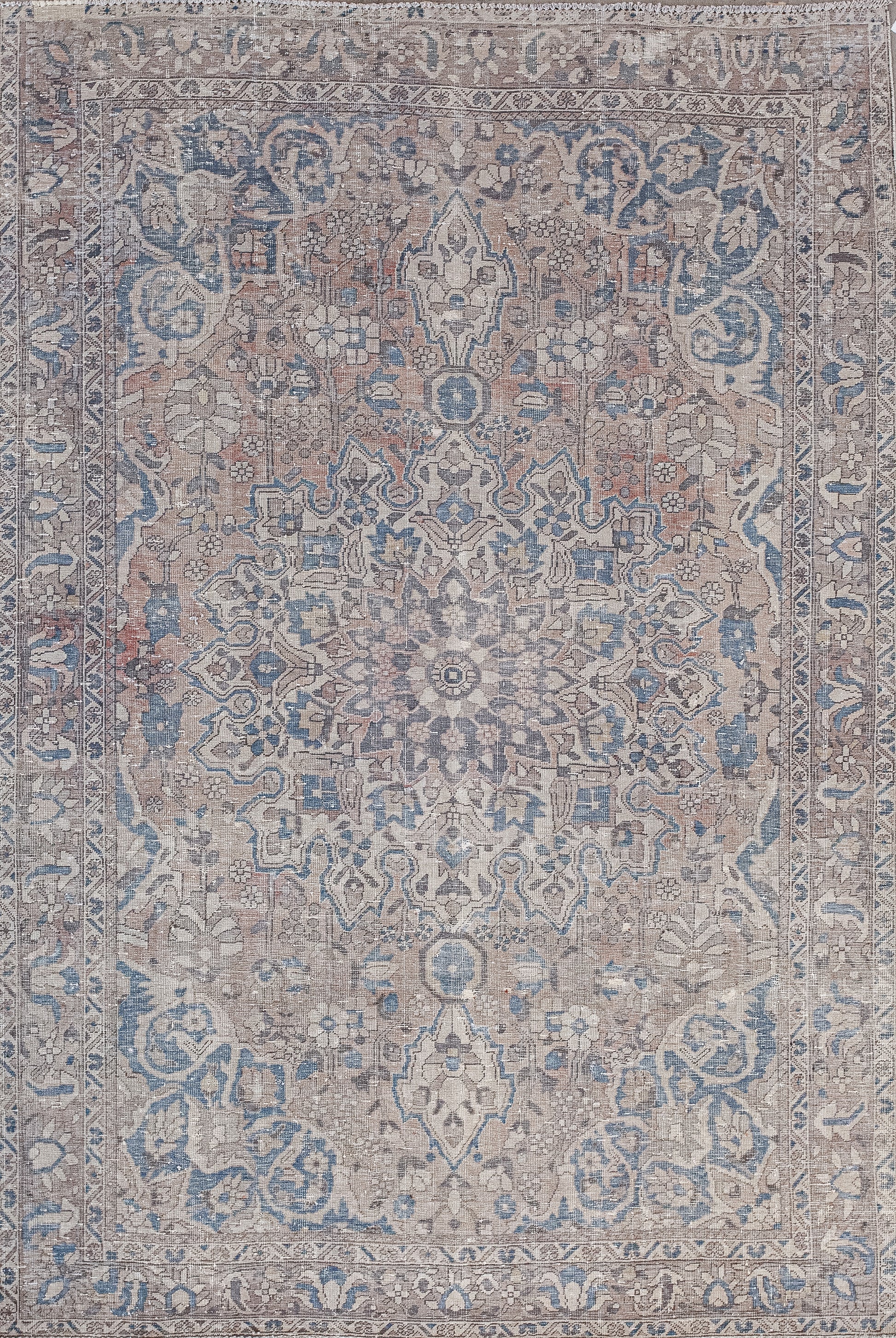 This serene rug was woven to convey discreet emotional transmissions. The quiet color scheme has hues in blue, brown, and gray.