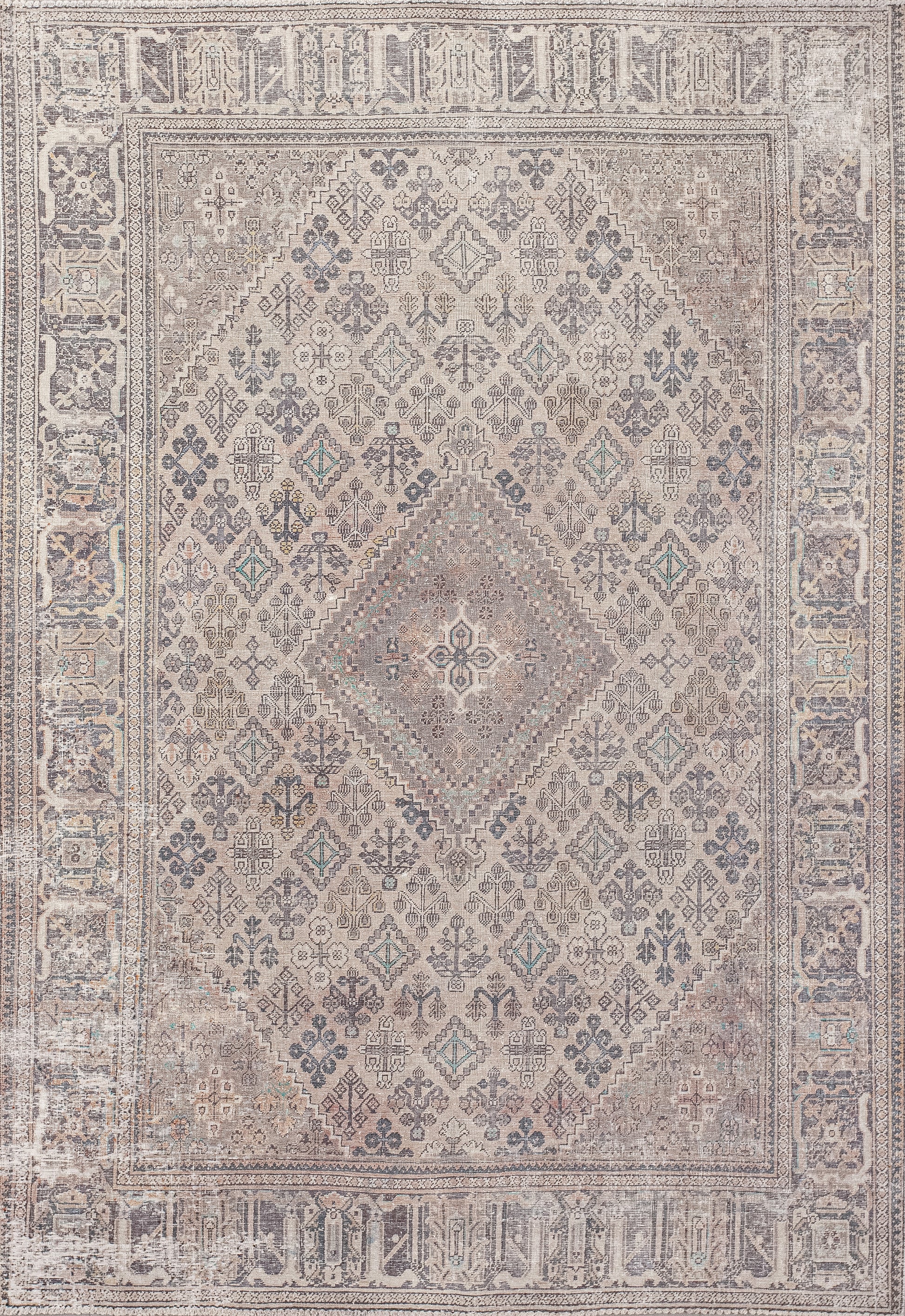This luxurious rug comes with the richness of history and honor. The muted color palette has gold, beige, strong gray, and highlights in green. 