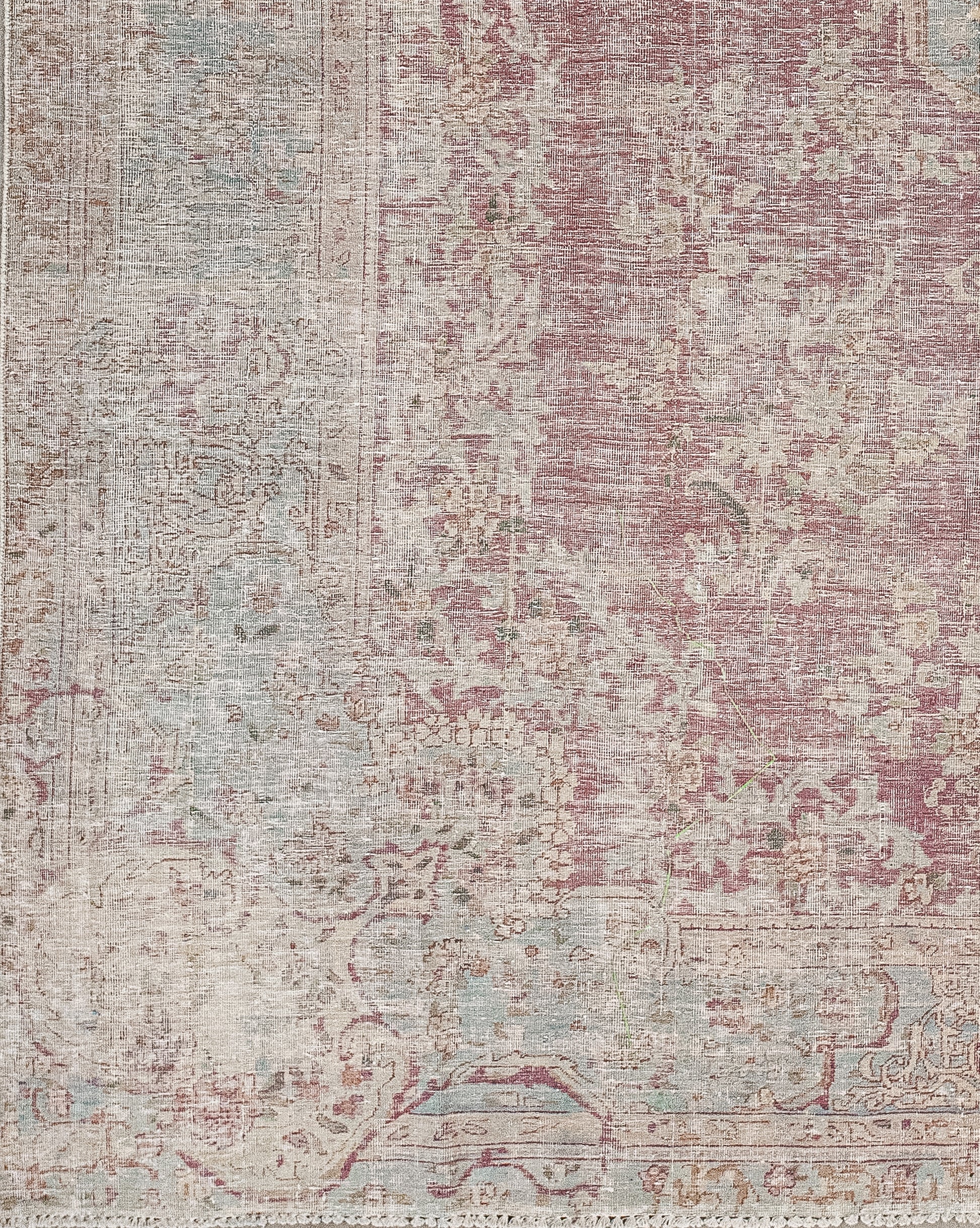 The color palette has burgundy for the background, tan for the perimeter, and light-green accents. 
