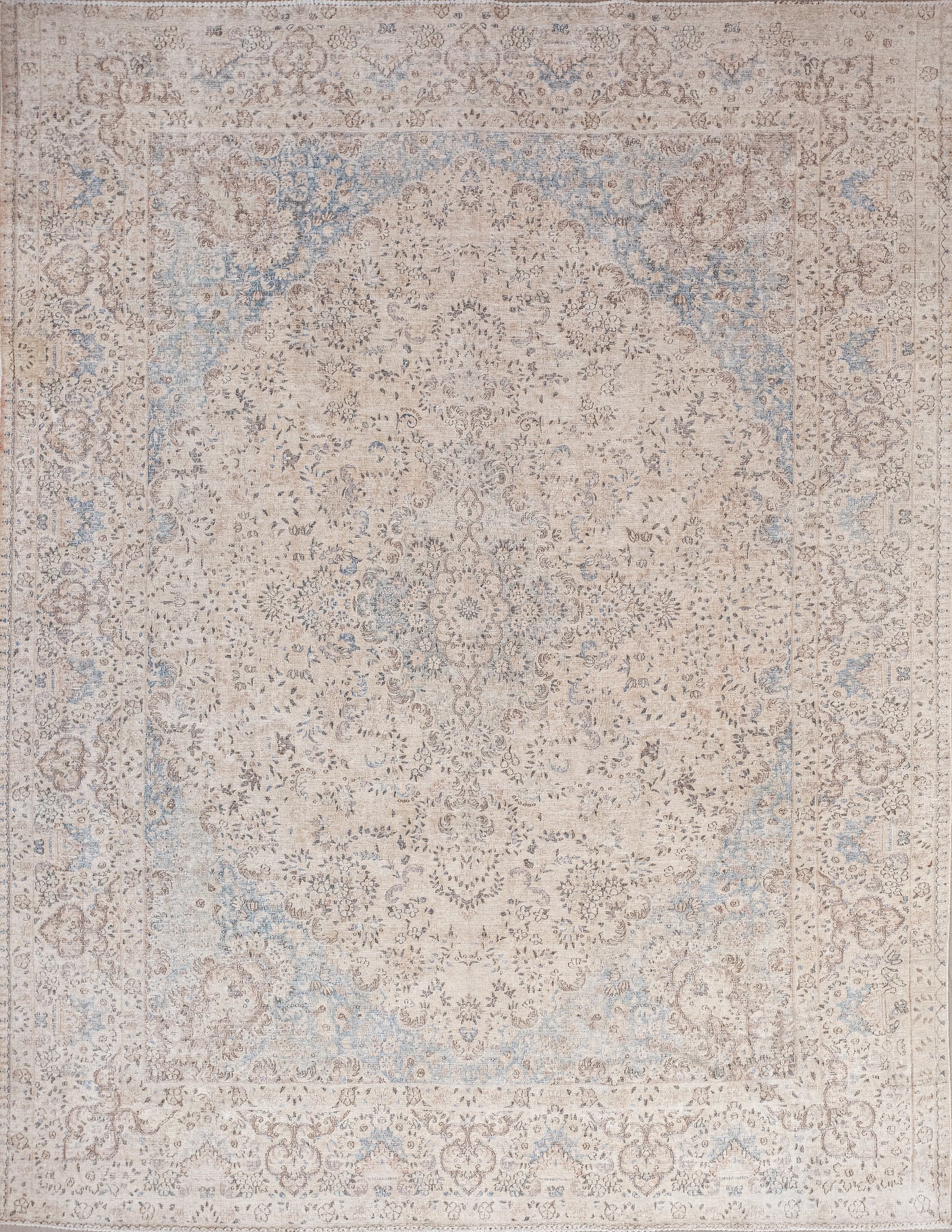 This old-fashioned rug was woven with an air of distinction. The color palette has browns and blues ranging from light to dark tones.
