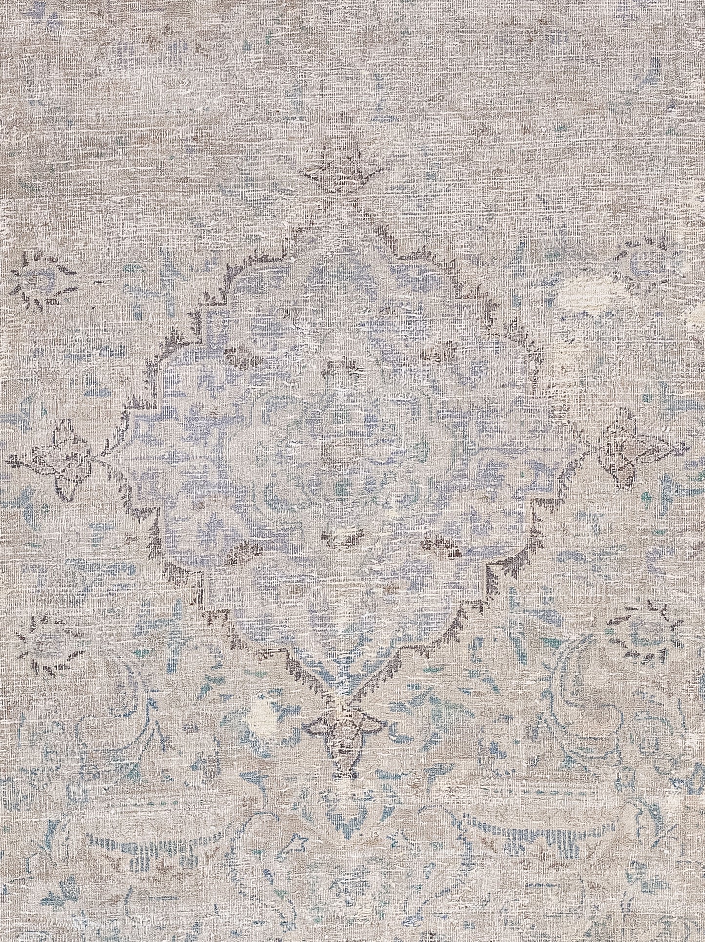 The foreground of the rug features a diamond-shaped ornament filled with symmetrical trims. 