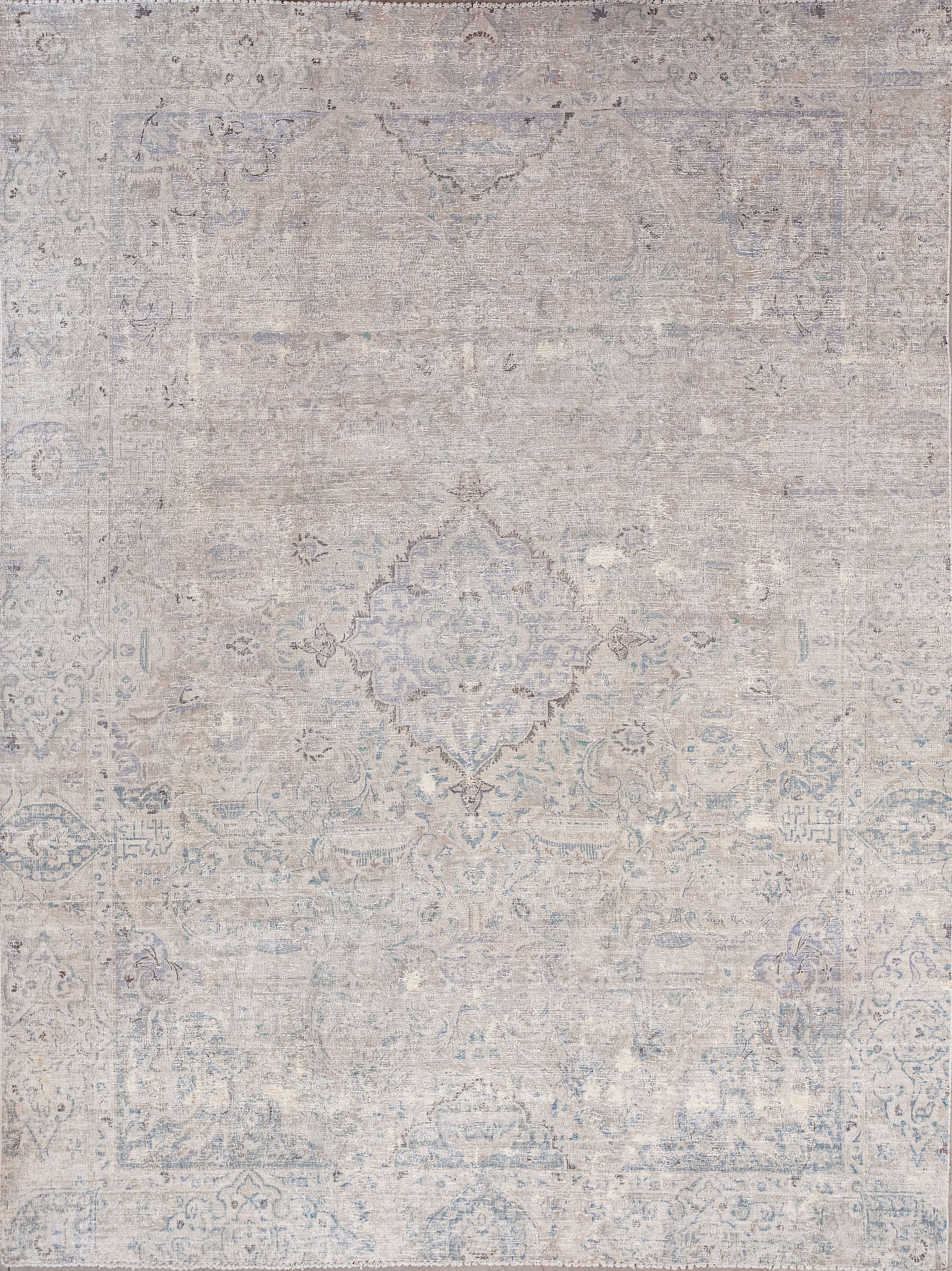 This venerable rug was woven with a distressed finish that makes it a non-slip rug. The color scheme has a beige background, and a bluish a pattern. 