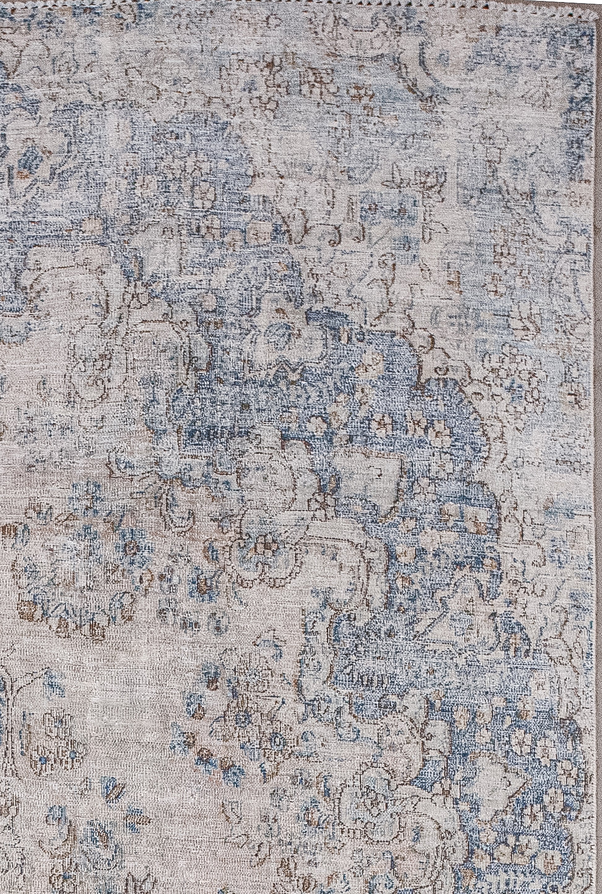 The boundary shows a huge blue mandala over the contour of the rug.