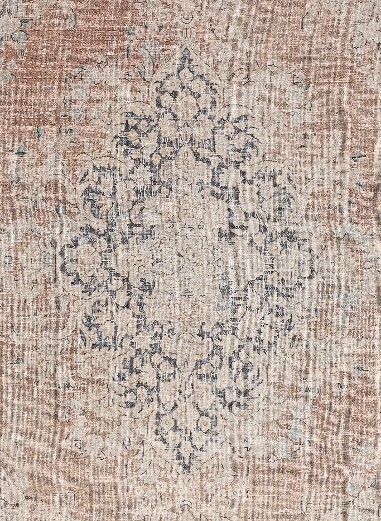 The center of the rug shows a lozenge form made up long leaves and flower heads, all arranged symmetrically.