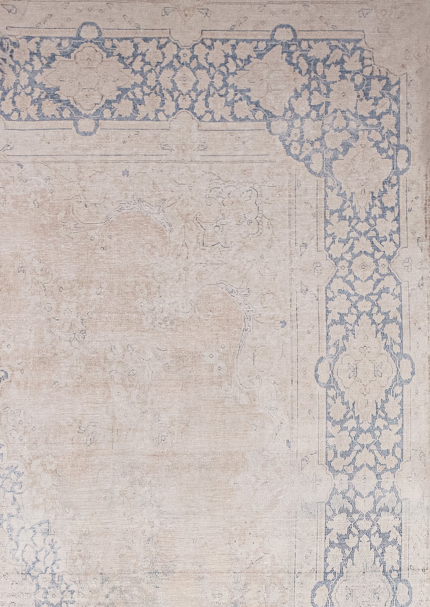 The outer margin has two ornamental borders that frame a thick blue one filled with a paisley floral print in beige.