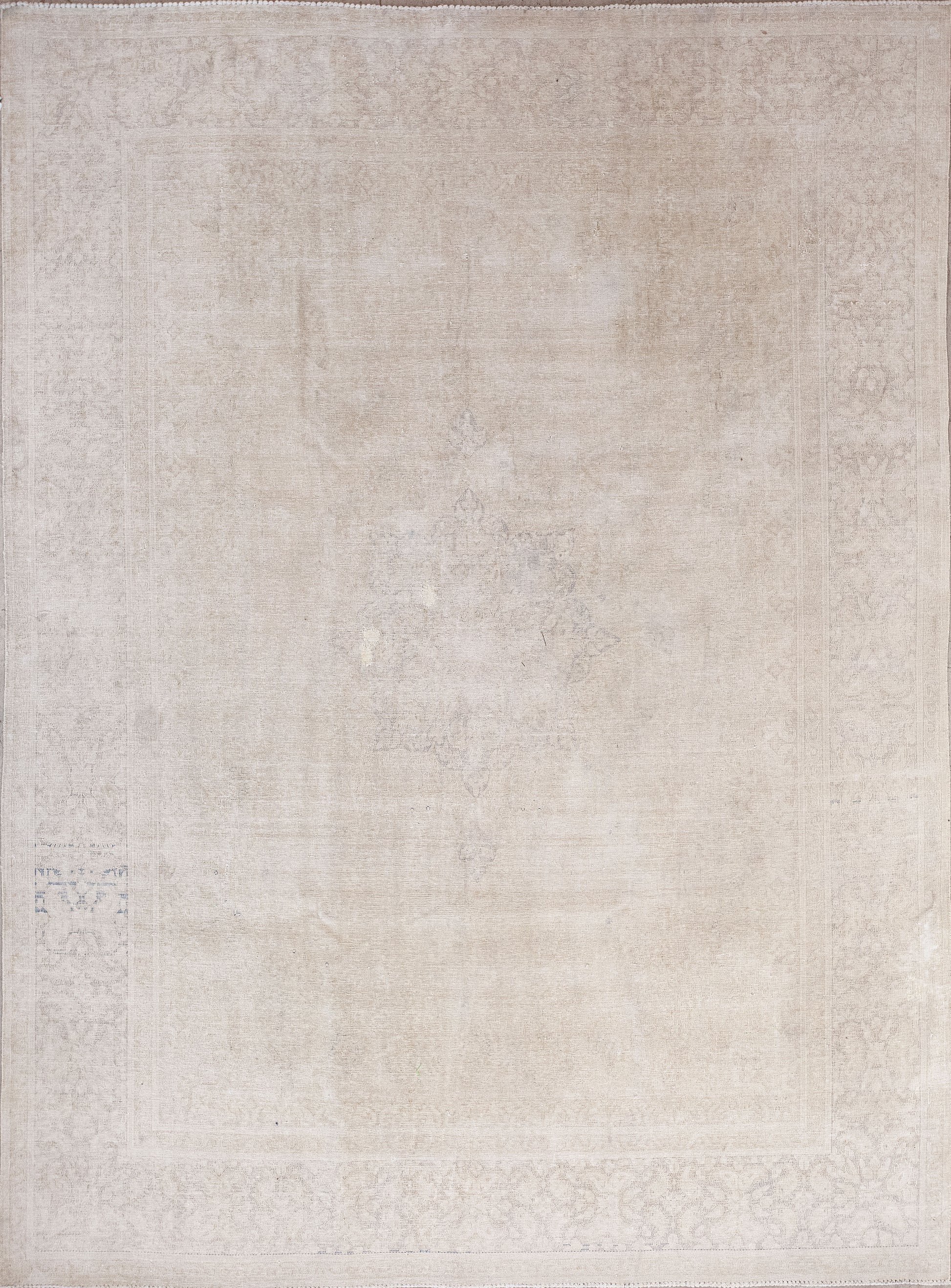 Ancient rug was woven in white with a faint flower pattern. The simple color palette has linen and antique white.